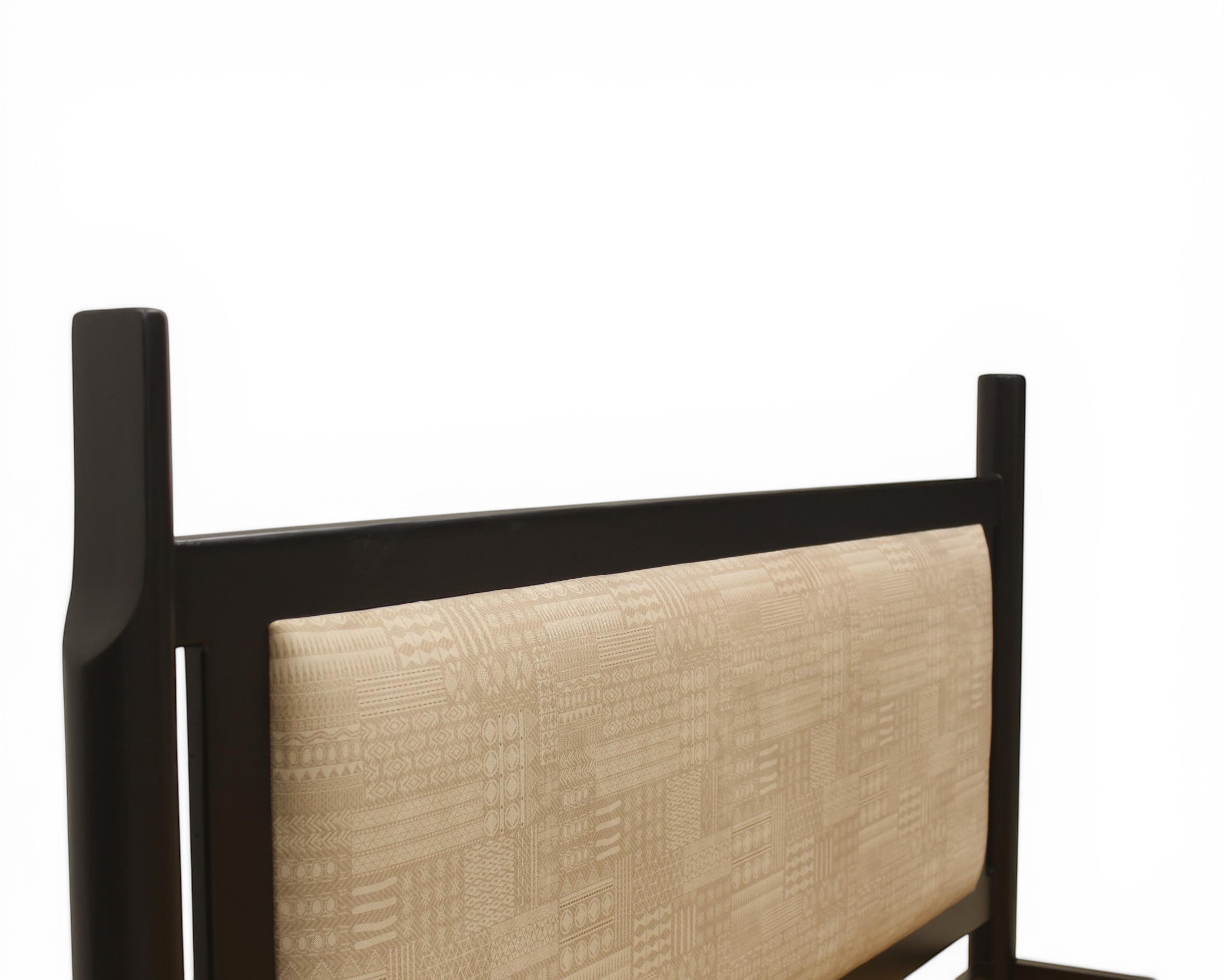 Nakoda Homes modern black metal bed frame with beige upholstered headboard featuring geometric pattern.