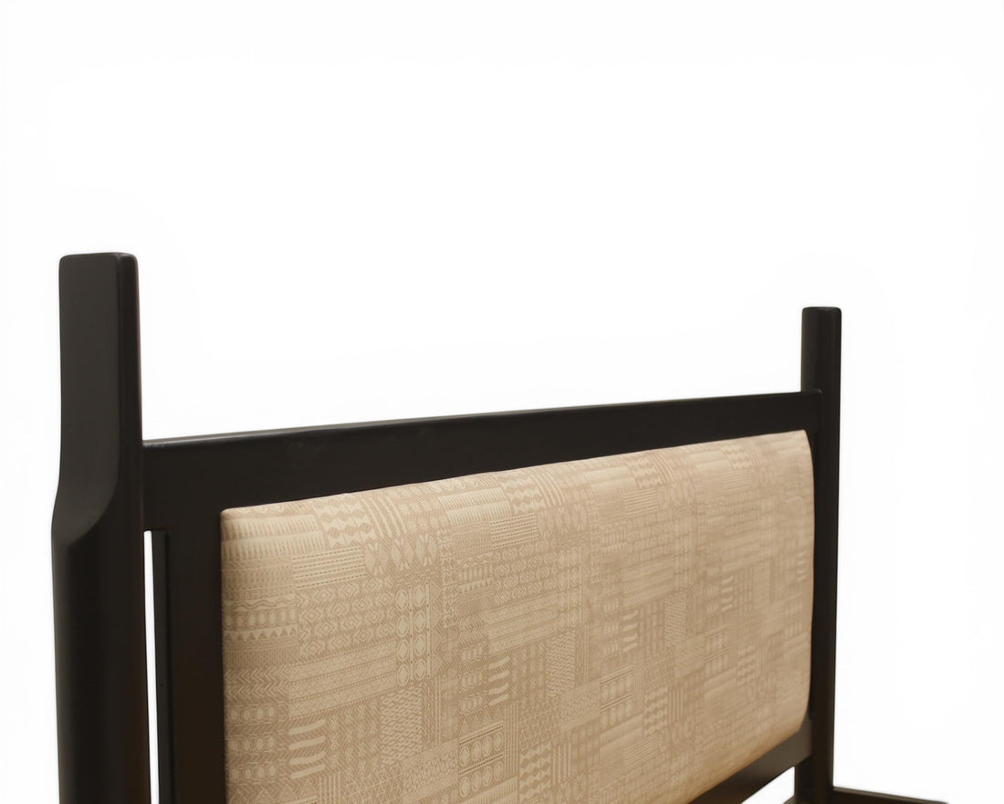 Nakoda Homes modern black metal bed frame with beige upholstered headboard featuring geometric pattern.