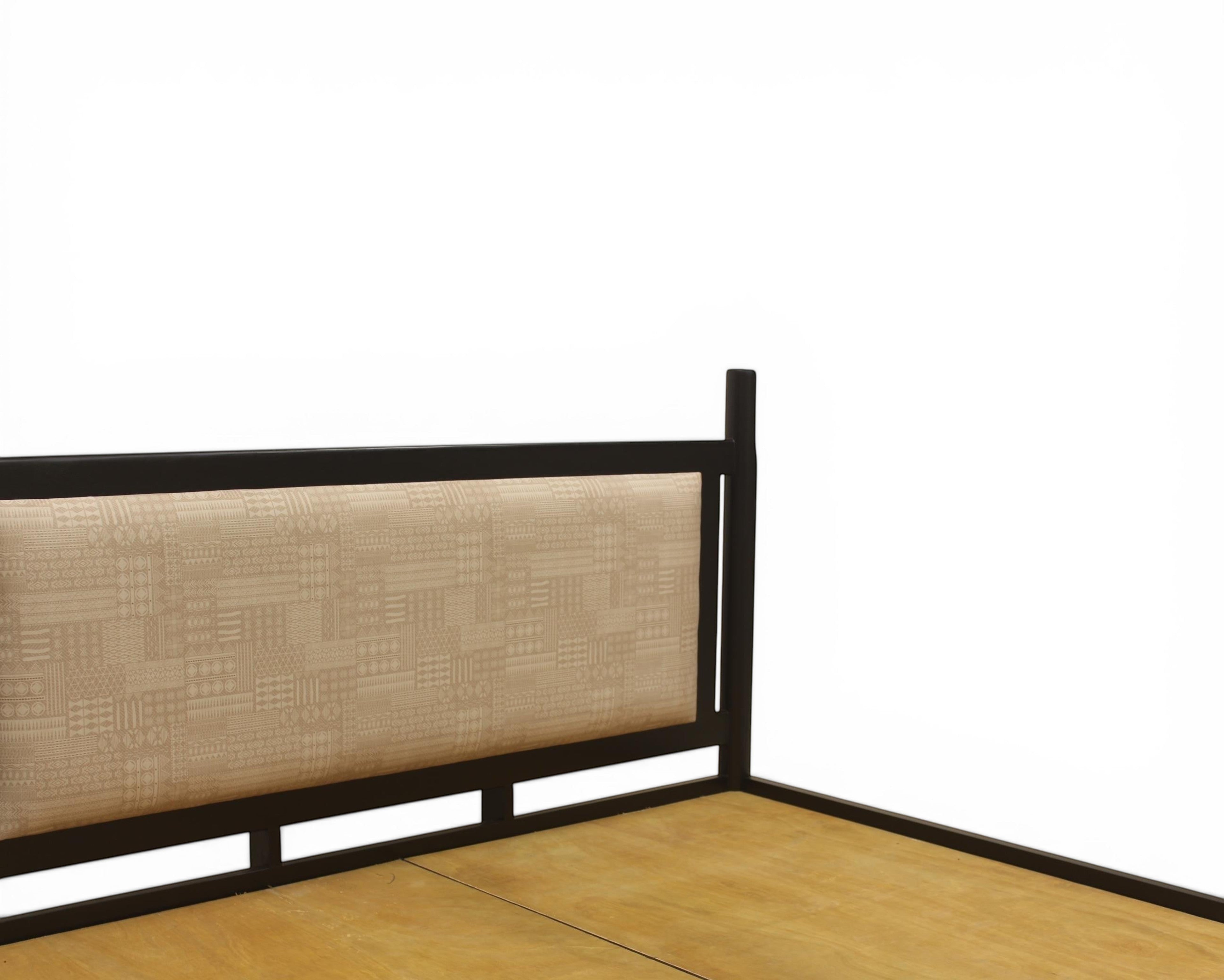 Nakoda Homes black metal platform bed frame with beige geometric upholstered headboard.