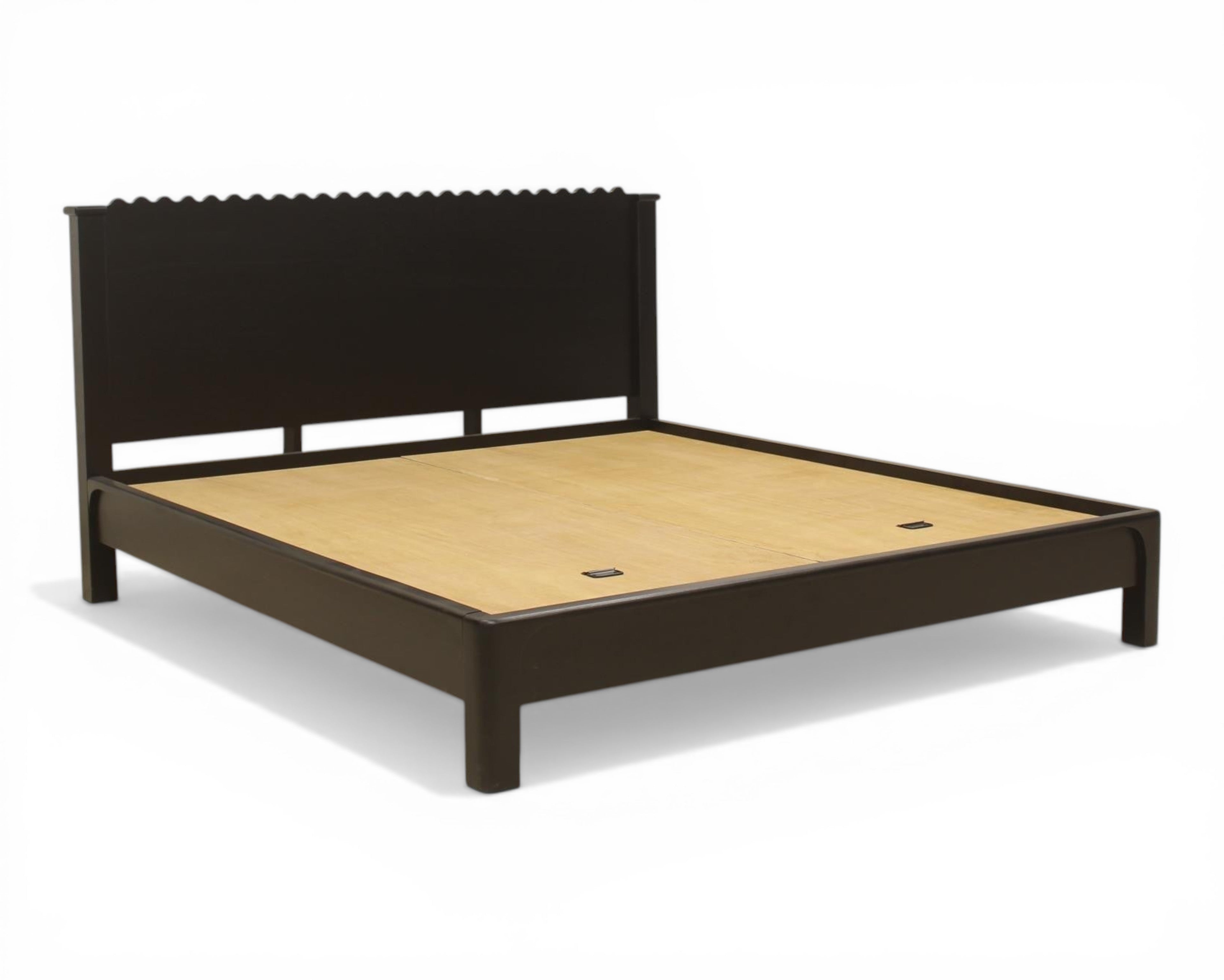 Nakoda Homes black wood platform bed frame with scalloped headboard and low profile design.