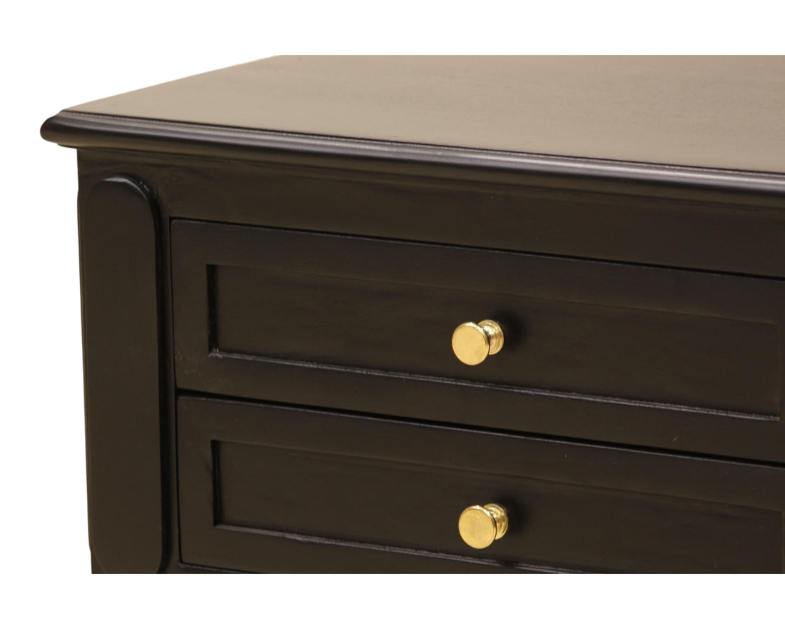 Nakoda Homes black wooden nightstand with two drawers, gold hardware, and decorative legs. Offers ample storage and classic elegance.
