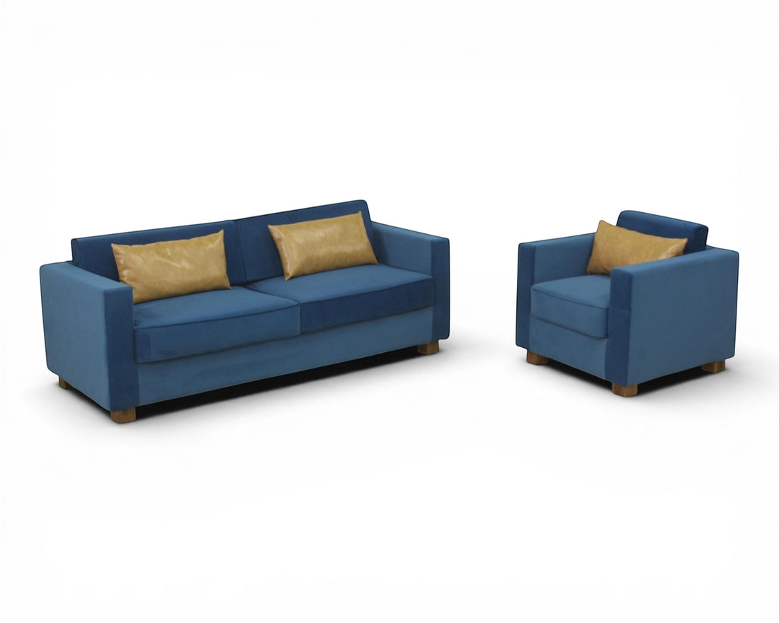 Nakoda Homes blue velvet sofa set with tan accent pillows. Modern, upholstered, comfortable living room furniture.