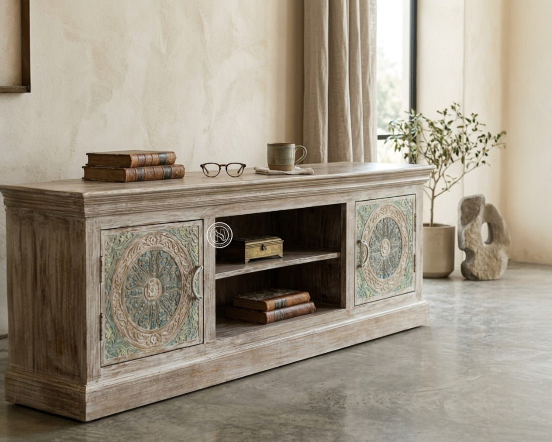 Nakoda Homes Calista TV unit with hand-carved floral and geometric patterns on distressed wood doors.
