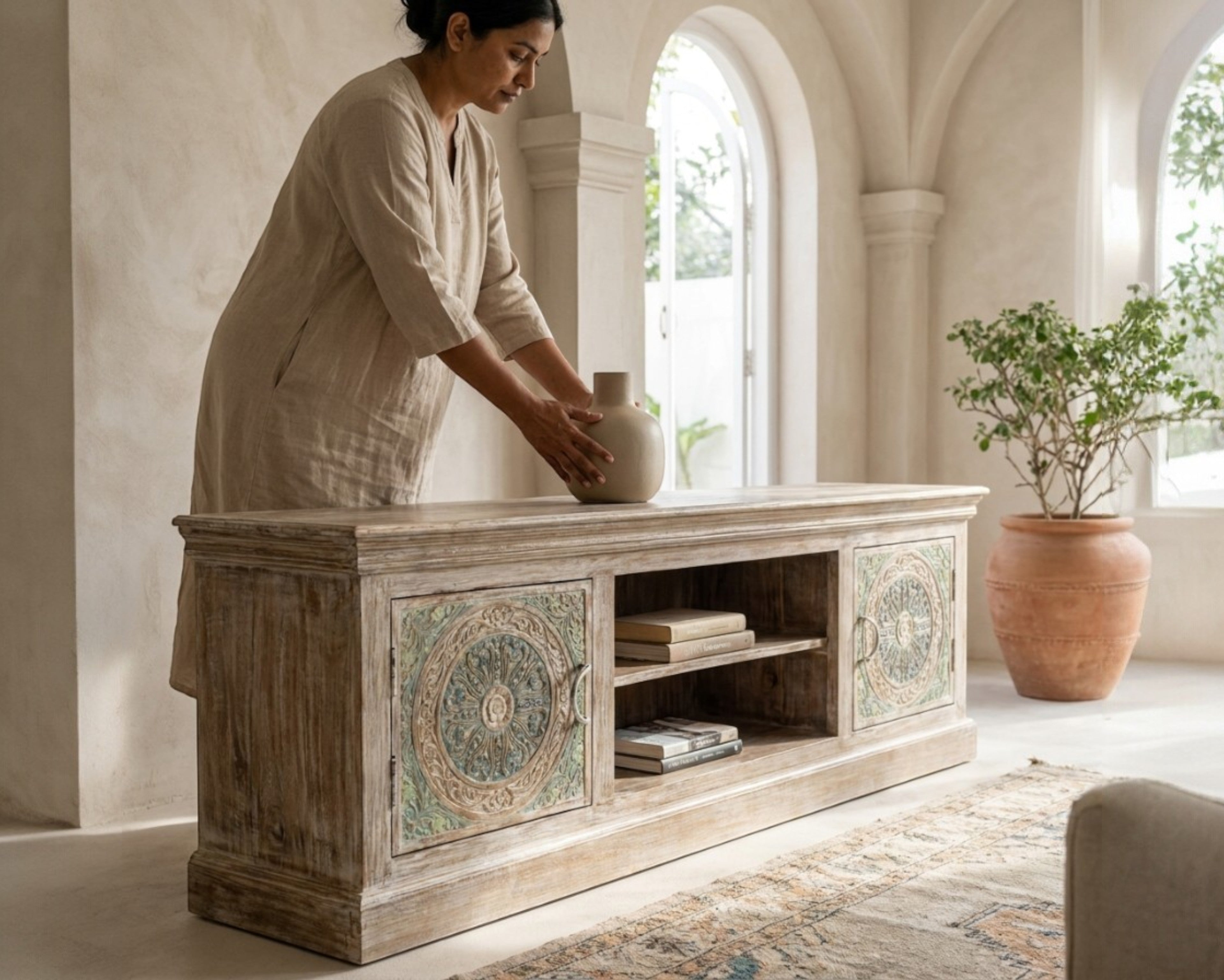 Nakoda Homes Calista TV Unit with hand-carved floral and geometric patterns, distressed wood finish, open shelves and cabinets.