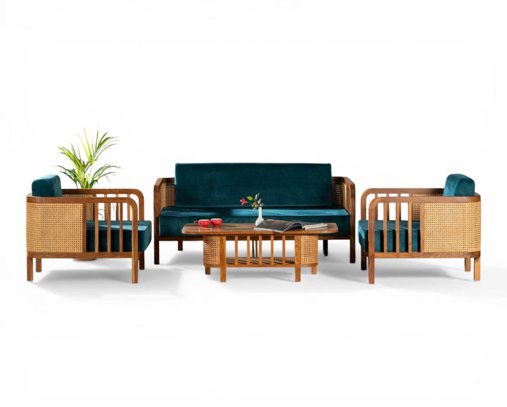 Nakoda Homes 3-seater sofa and armchair set in deep teal velvet with natural wood and cane accents.