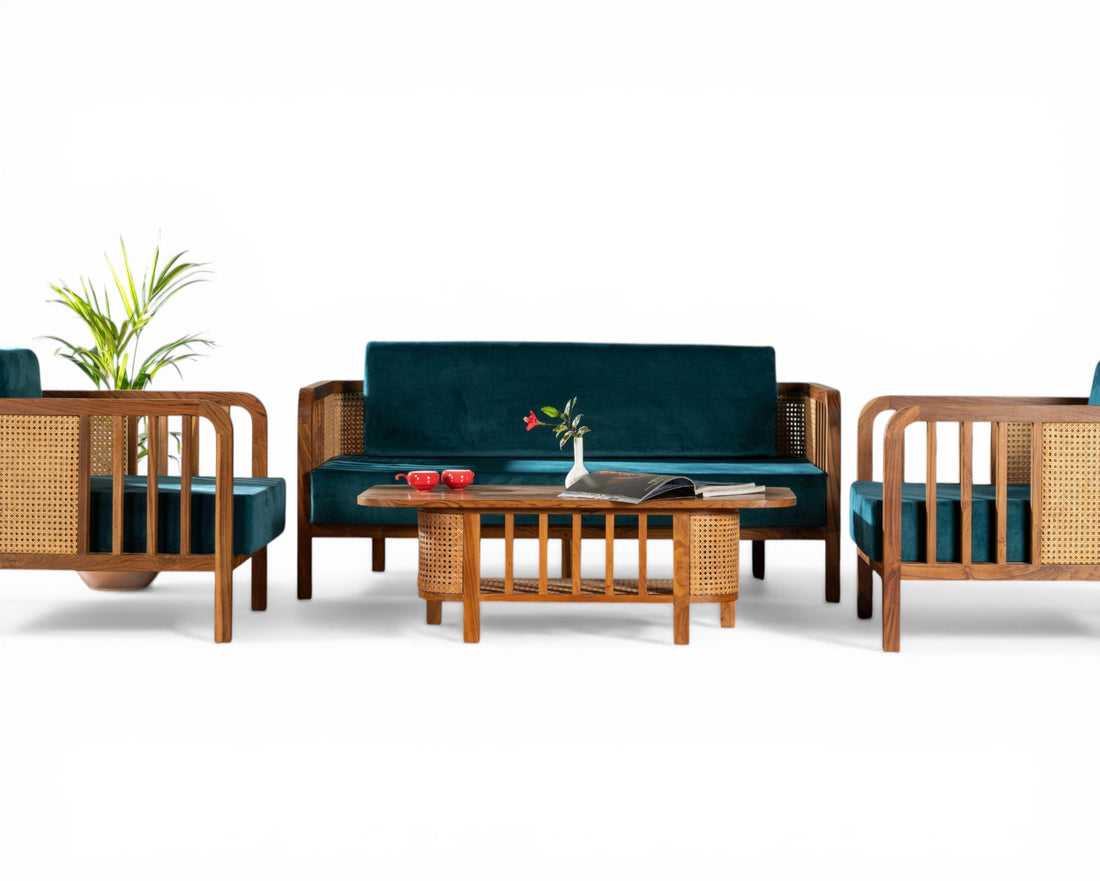 Nakoda Homes 3-seater sofa and armchair set in deep teal velvet with natural wood and cane accents.