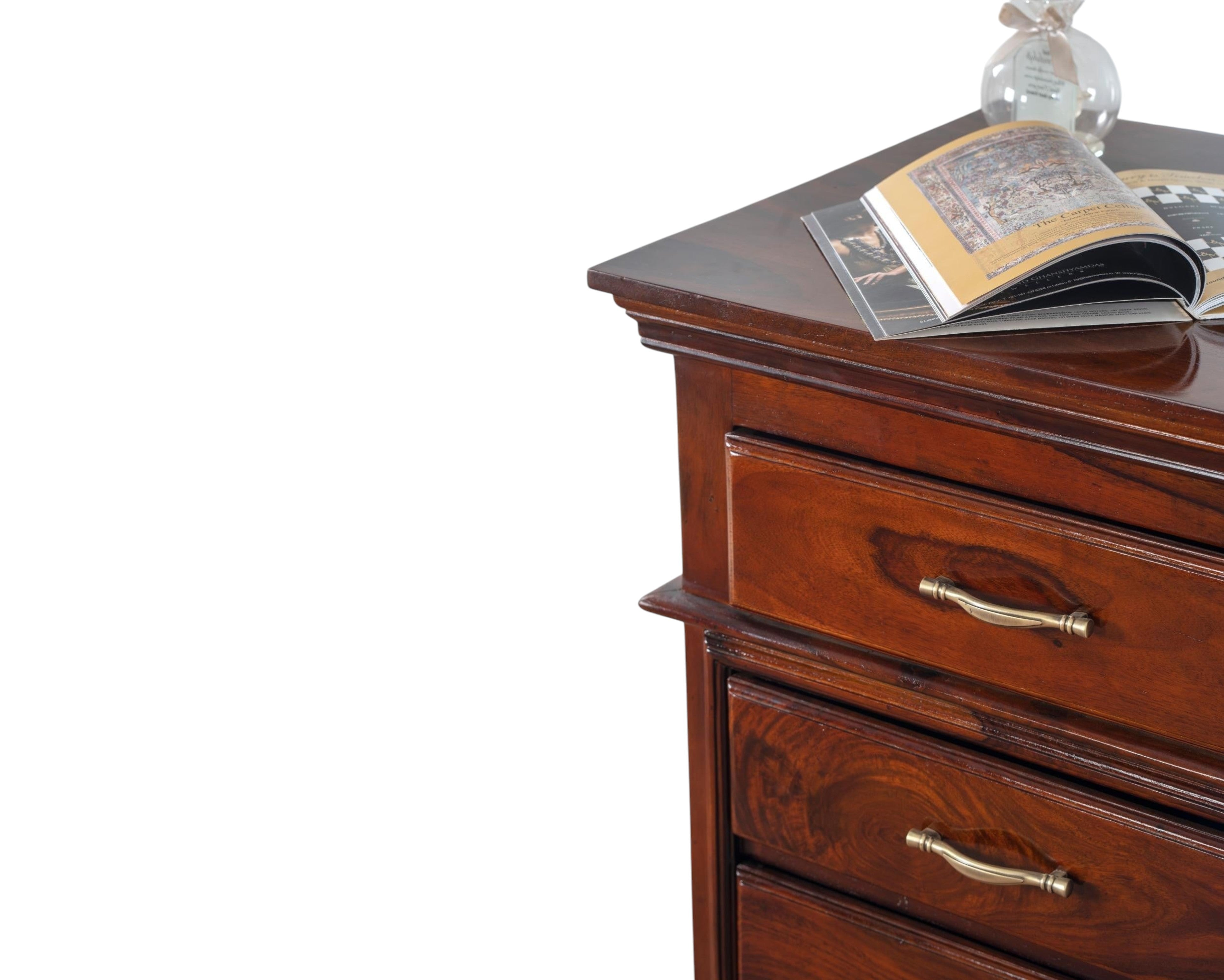Nakoda Homes classic solid wood chest of drawers in warm brown with brass hardware and polished finish.