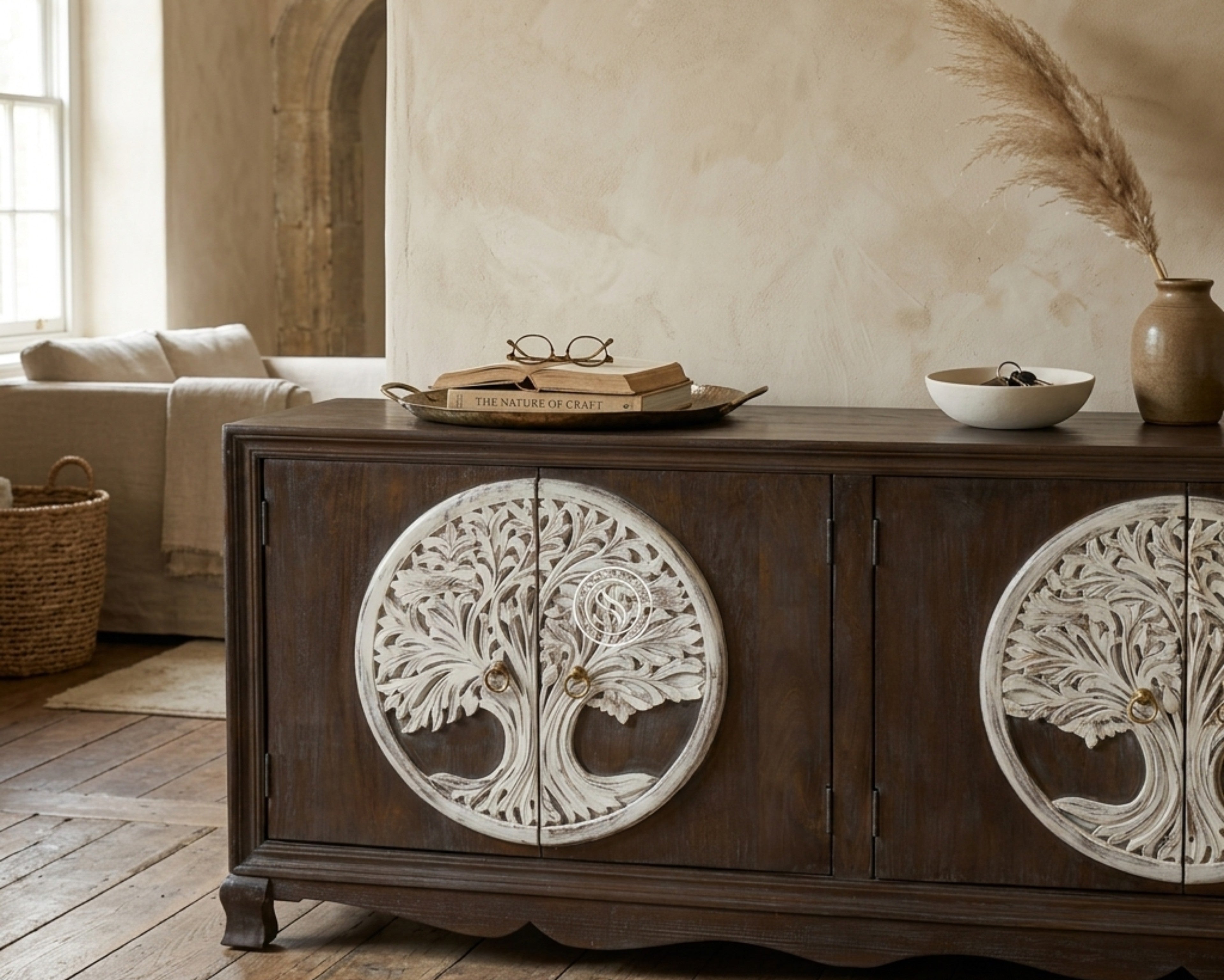 Nakoda Homes dark wood sideboard with white carved tree of life double doors and brass knobs on curved legs.