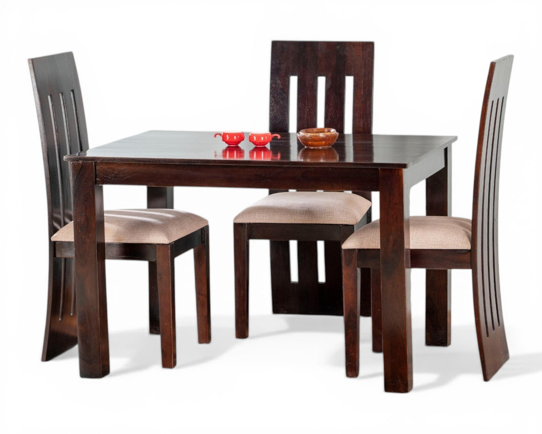 Nakoda Homes dark wood 4-seater dining set with cushioned chairs and modern slatted backs.