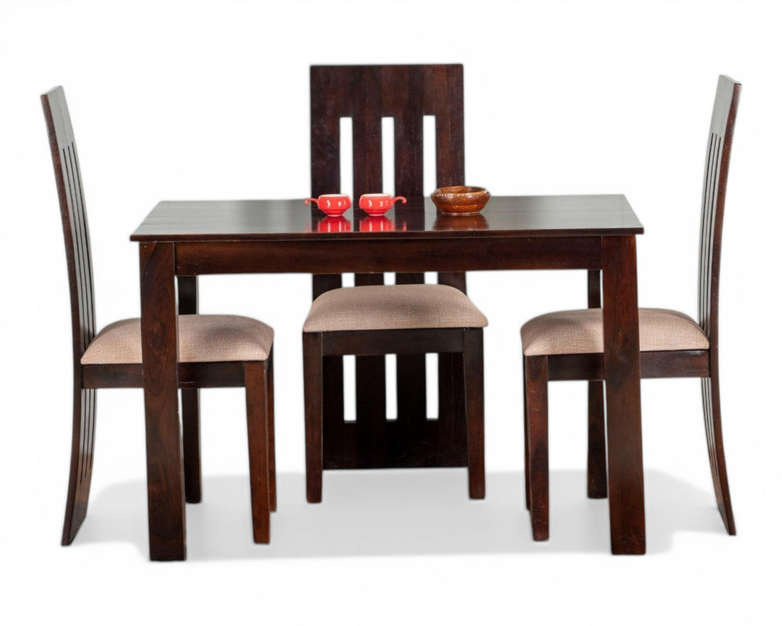 Nakoda Homes dark wood 4-seater dining set with cushioned chairs and a sleek, modern design.