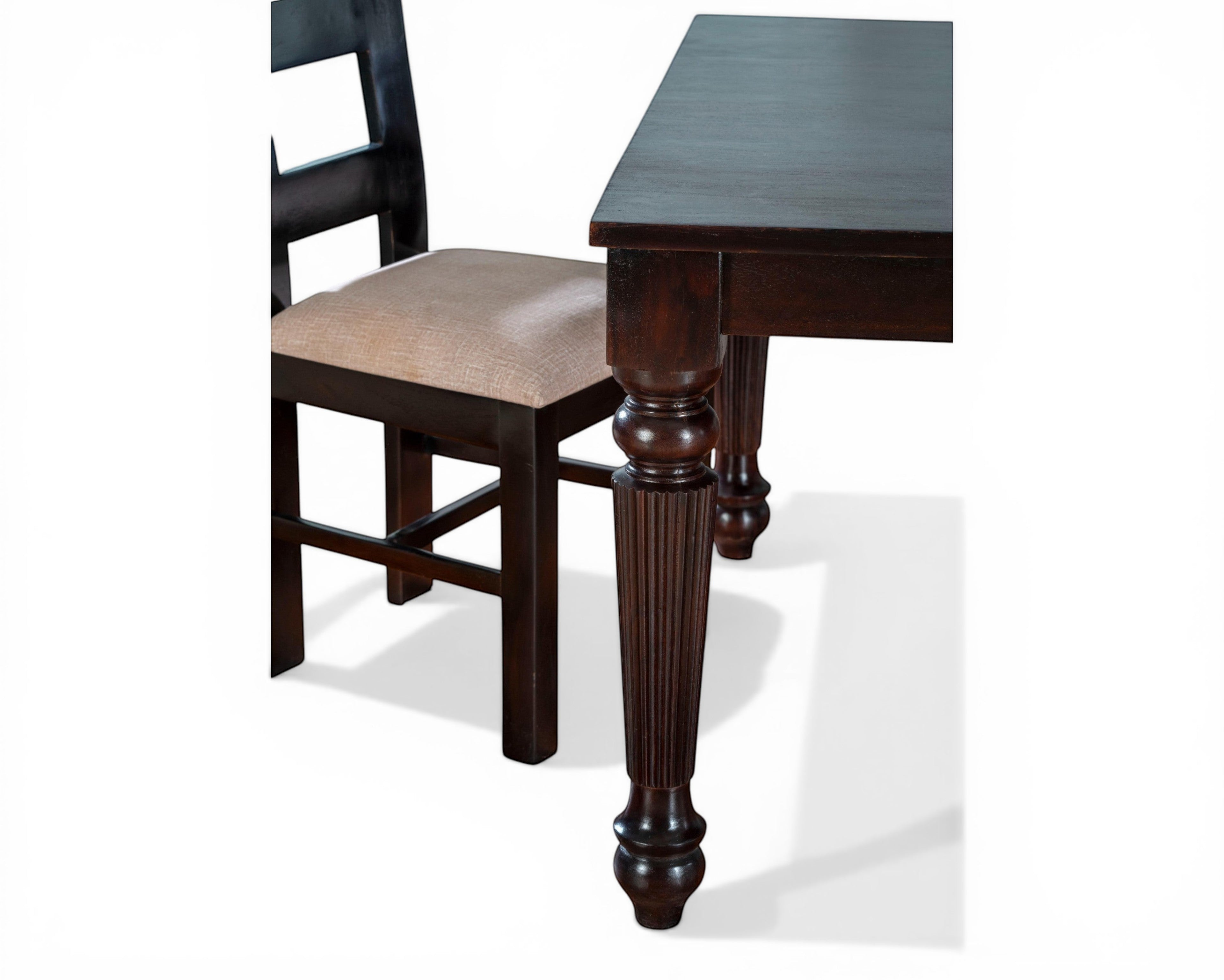 Nakoda Homes dark wood dining set with upholstered chairs. Features turned legs and classic design.