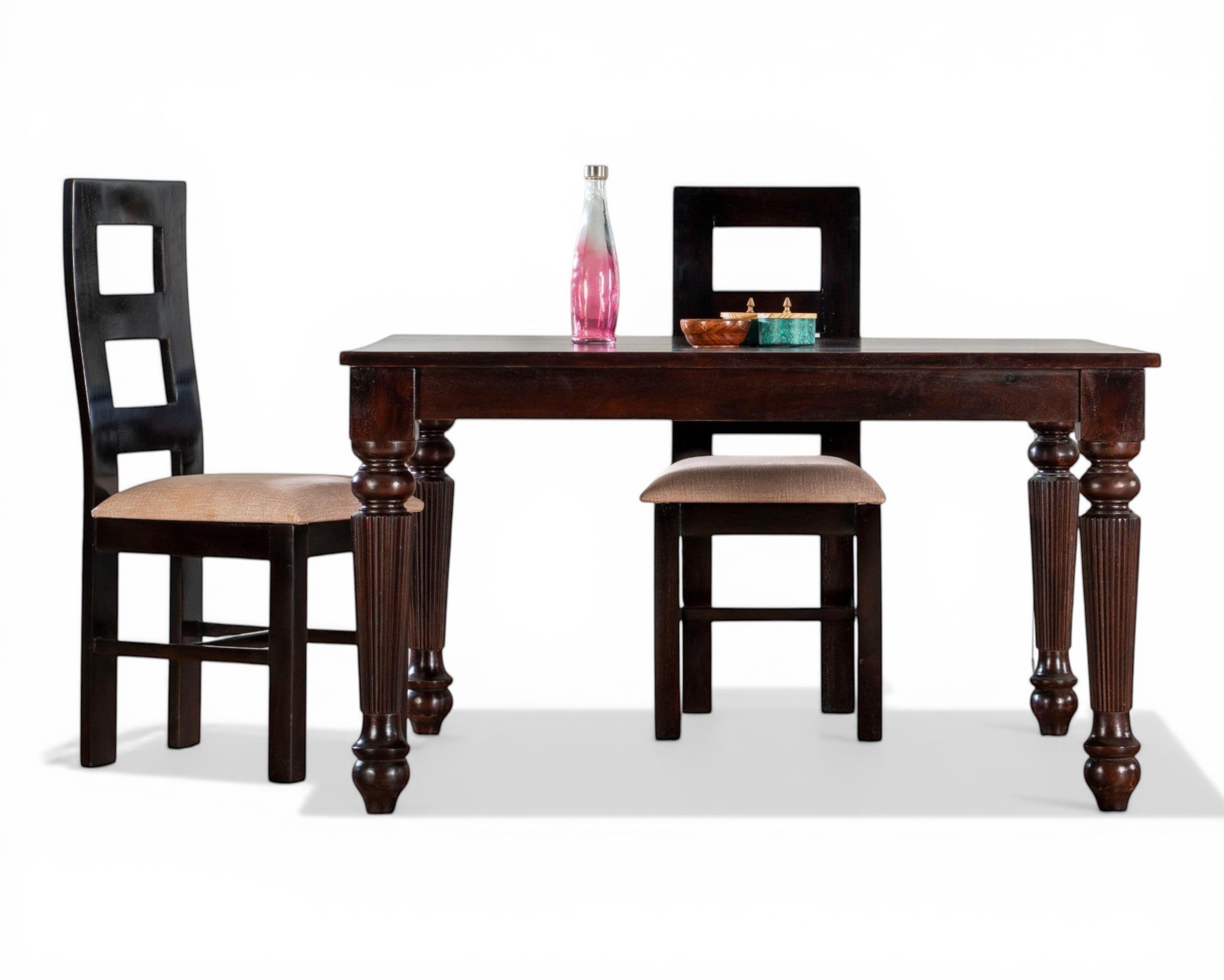 Nakoda Homes dark wood dining set with turned legs and upholstered chairs. Includes table and four chairs.