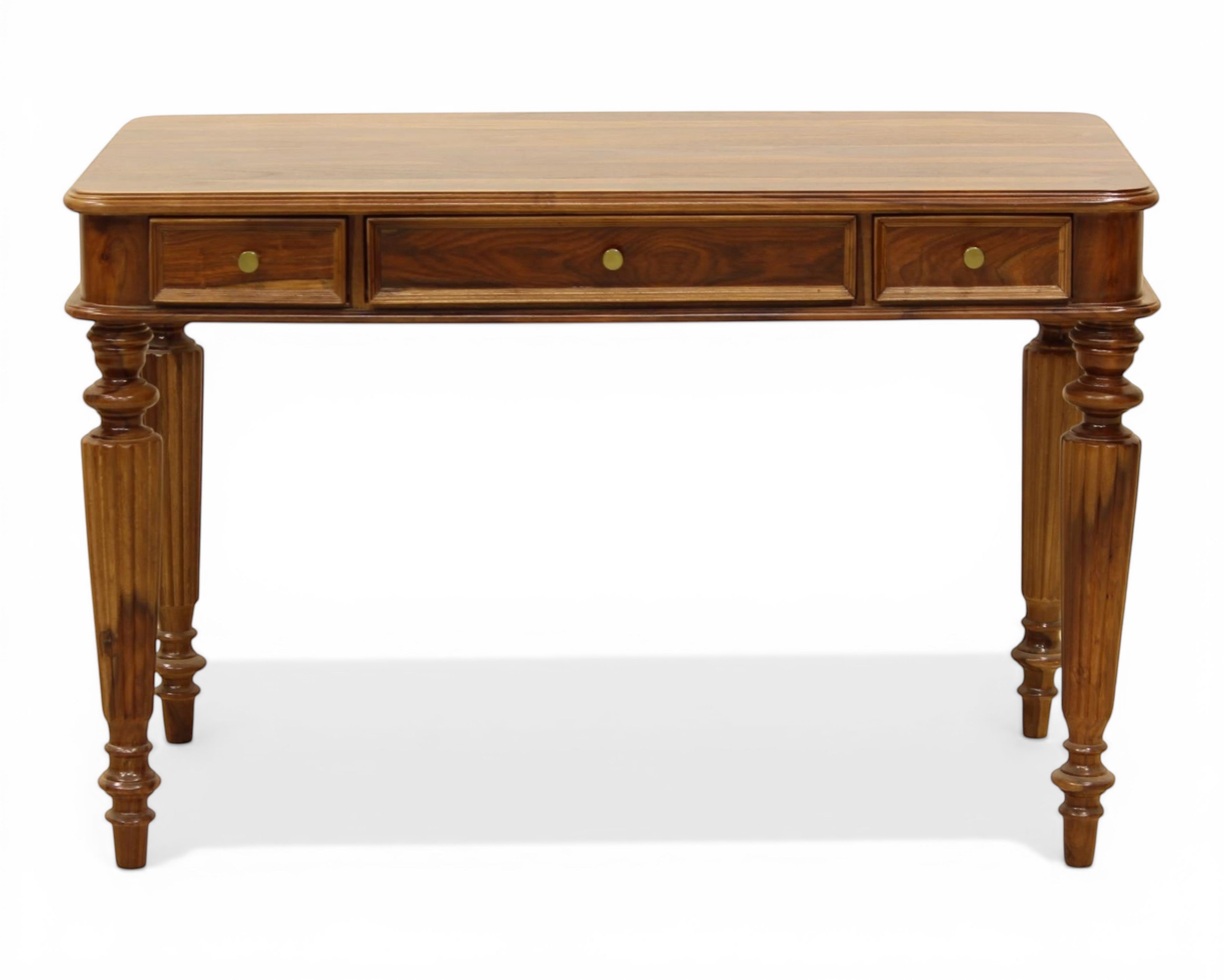 Nakoda Homes dark wood writing desk with three drawers and carved turned legs. Ideal for home office.