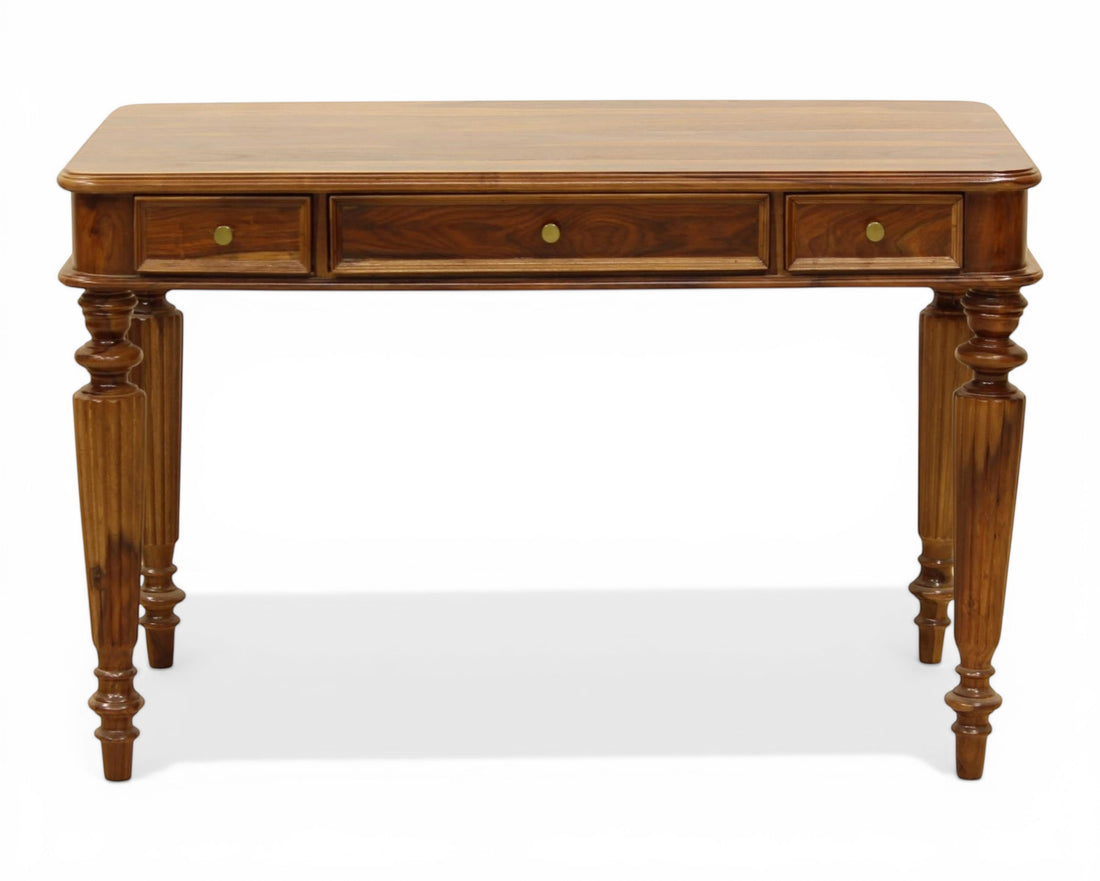 Nakoda Homes dark wood writing desk with three drawers and carved turned legs. Ideal for home office.