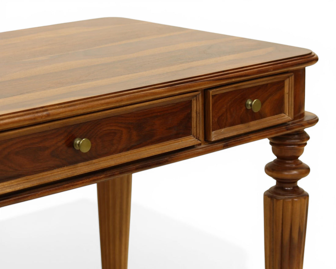 Nakoda Homes dark wood writing desk with brass knobs and fluted legs. Ideal for home office or living space.