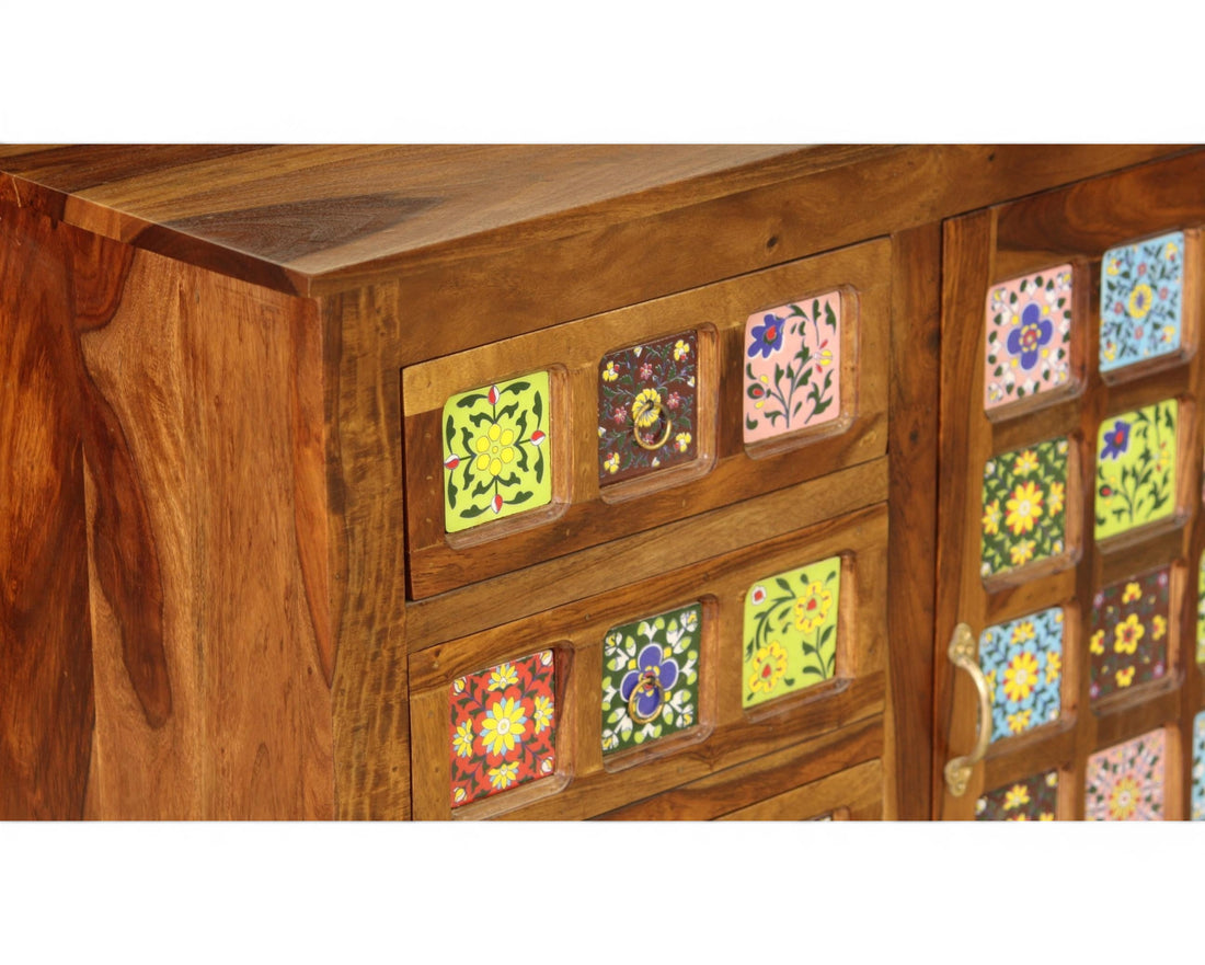 Nakoda Homes wooden cabinet with hand-painted floral tiles, drawers, and sliding door. Bohemian accent furniture.