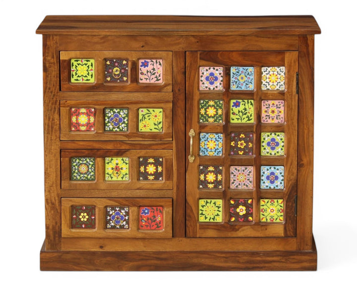 Nakoda Homes wooden cabinet with hand-painted floral ceramic tiles, drawers, and sliding door.