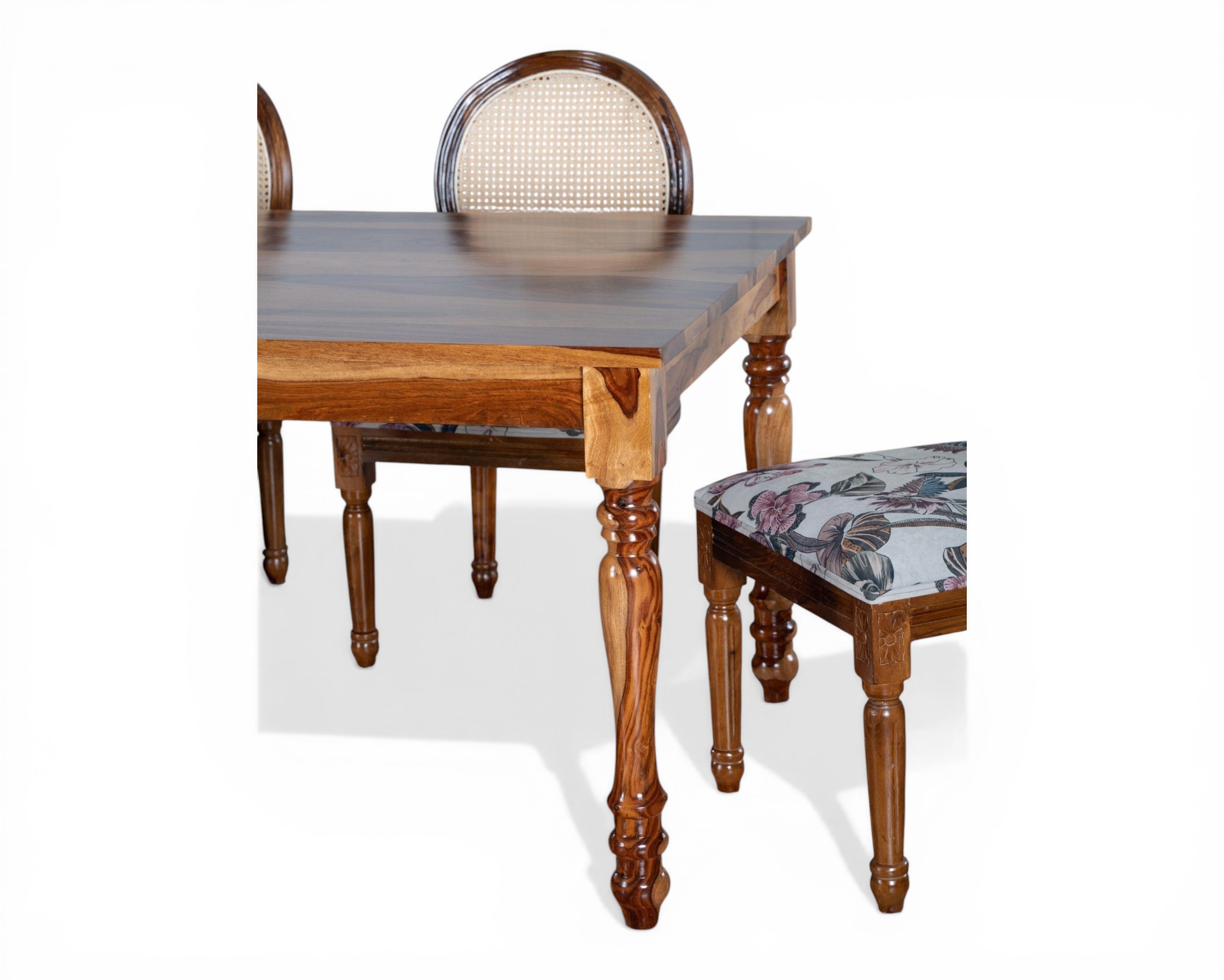 Nakoda Homes floral upholstered cane back dining chair with carved wooden frame and elegant legs.