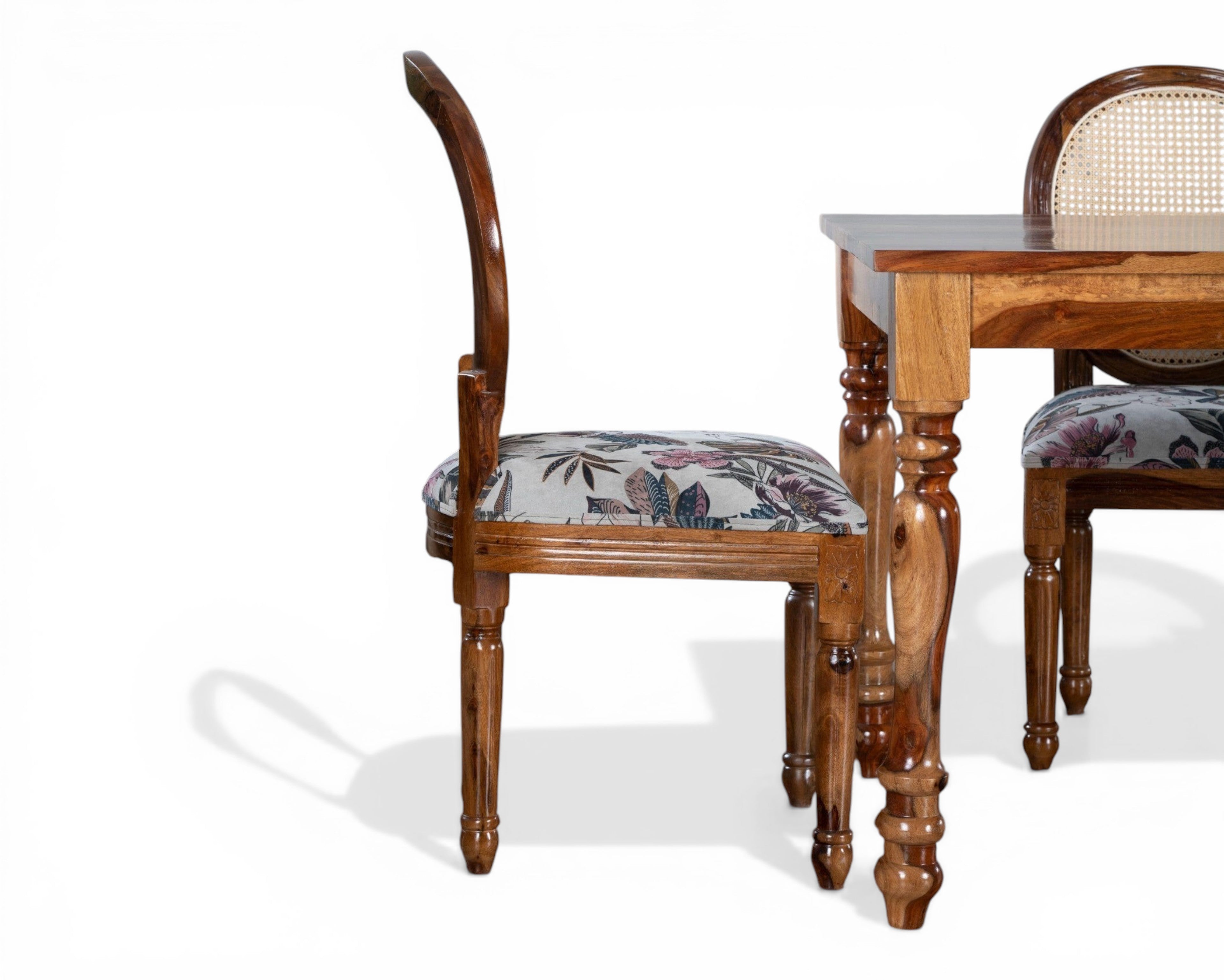 Nakoda Homes wooden dining chair with upholstered floral seat and cane back. Elegant carved frame.
