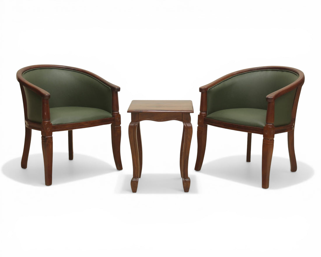 Nakoda Homes classic barrel-back accent chair in forest green faux leather with dark wood frame and turned legs.