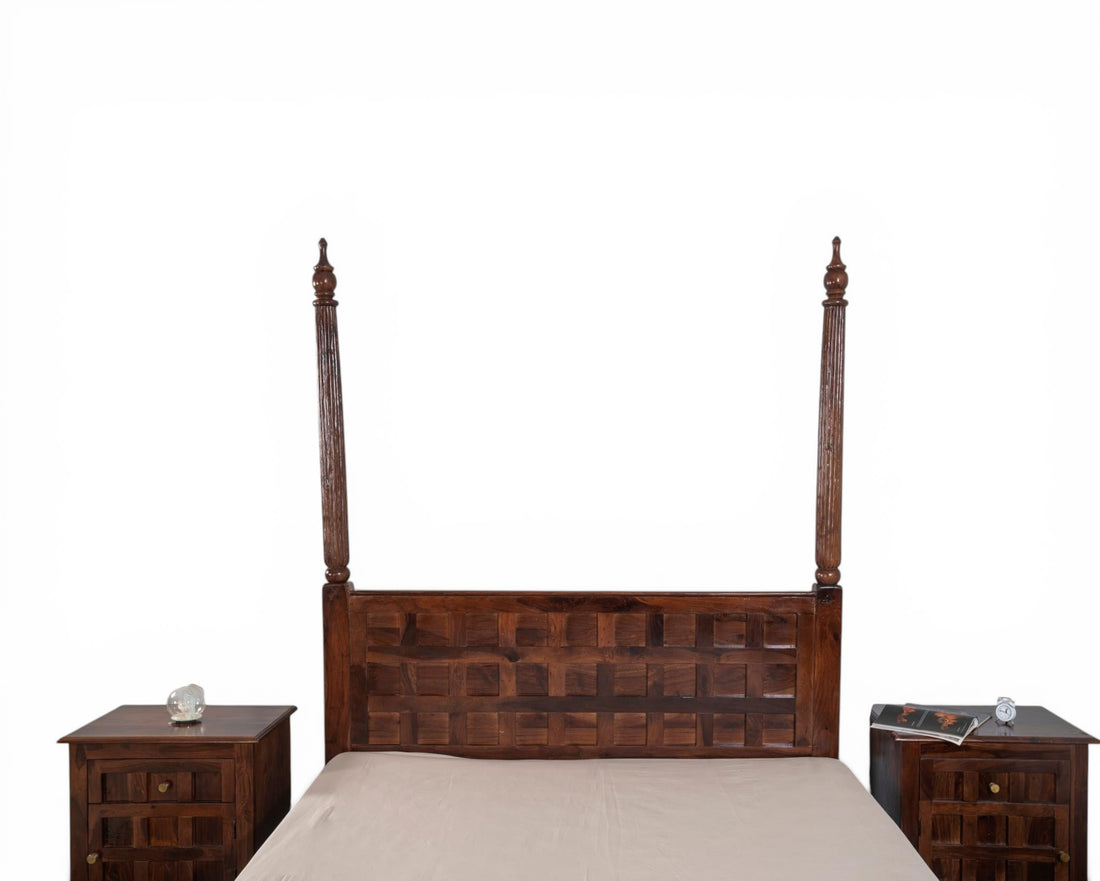 Nakoda Homes dark wood four poster bed frame with geometric carved headboard and turned posts.