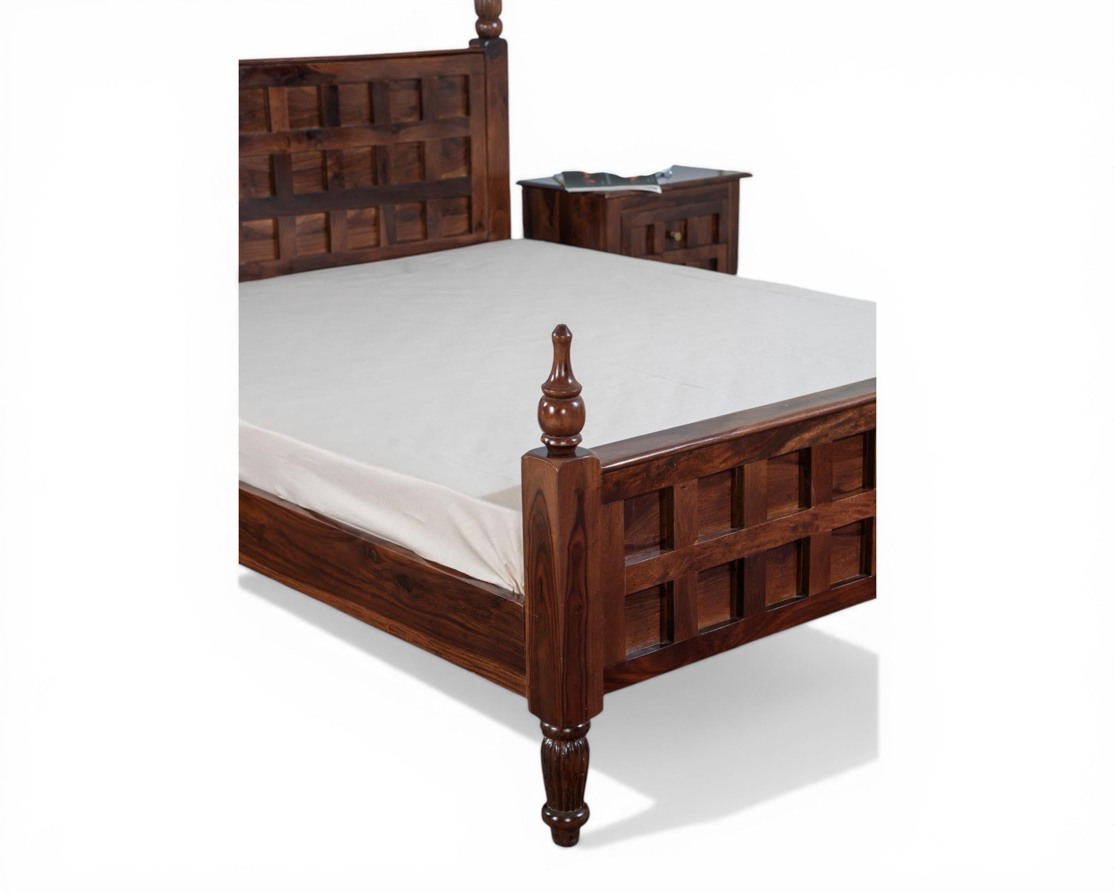 Nakoda Homes four poster bed frame in dark wood with geometric carved headboard and turned legs.