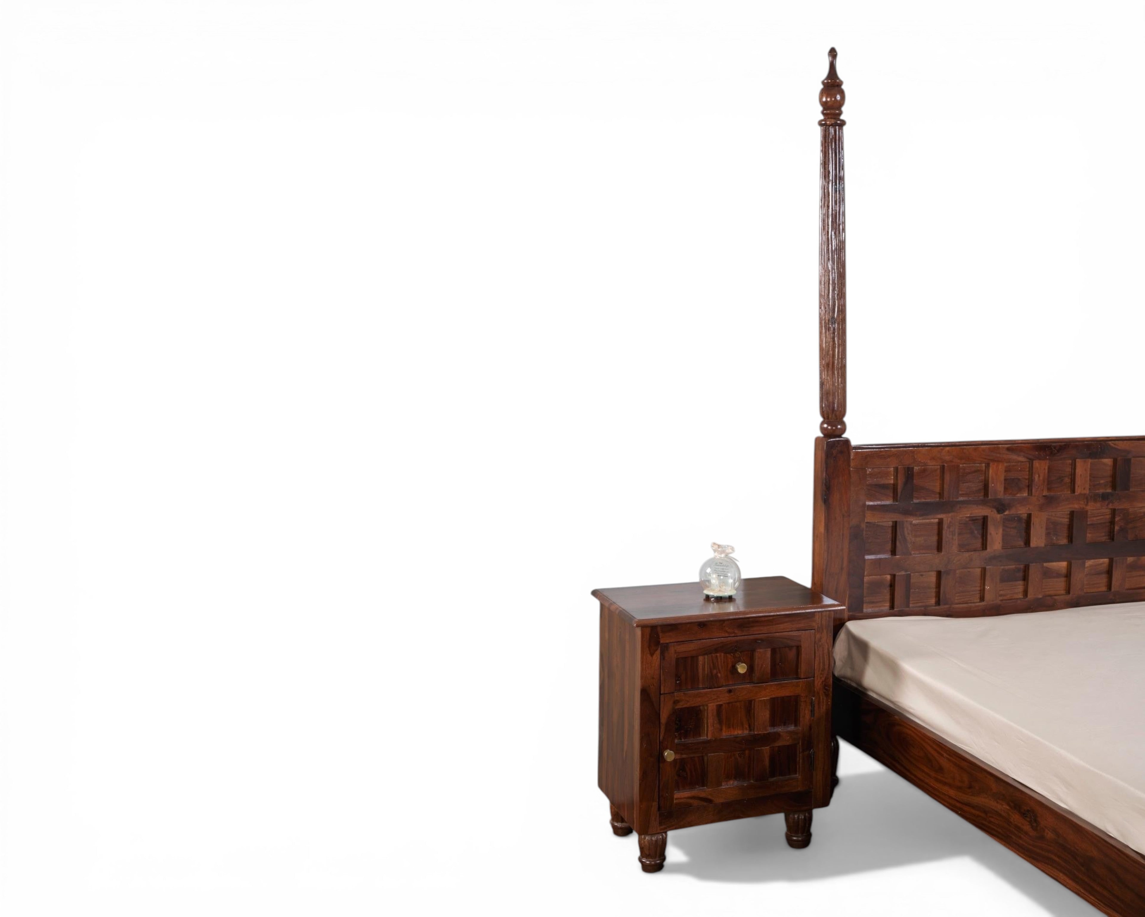 Nakoda Homes solid wood four-poster bed frame with geometric carved headboard and turned legs.