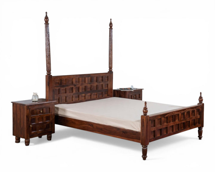 Nakoda Homes solid wood four-poster bed frame with geometric carved headboard and footboard, turned legs, and finials.