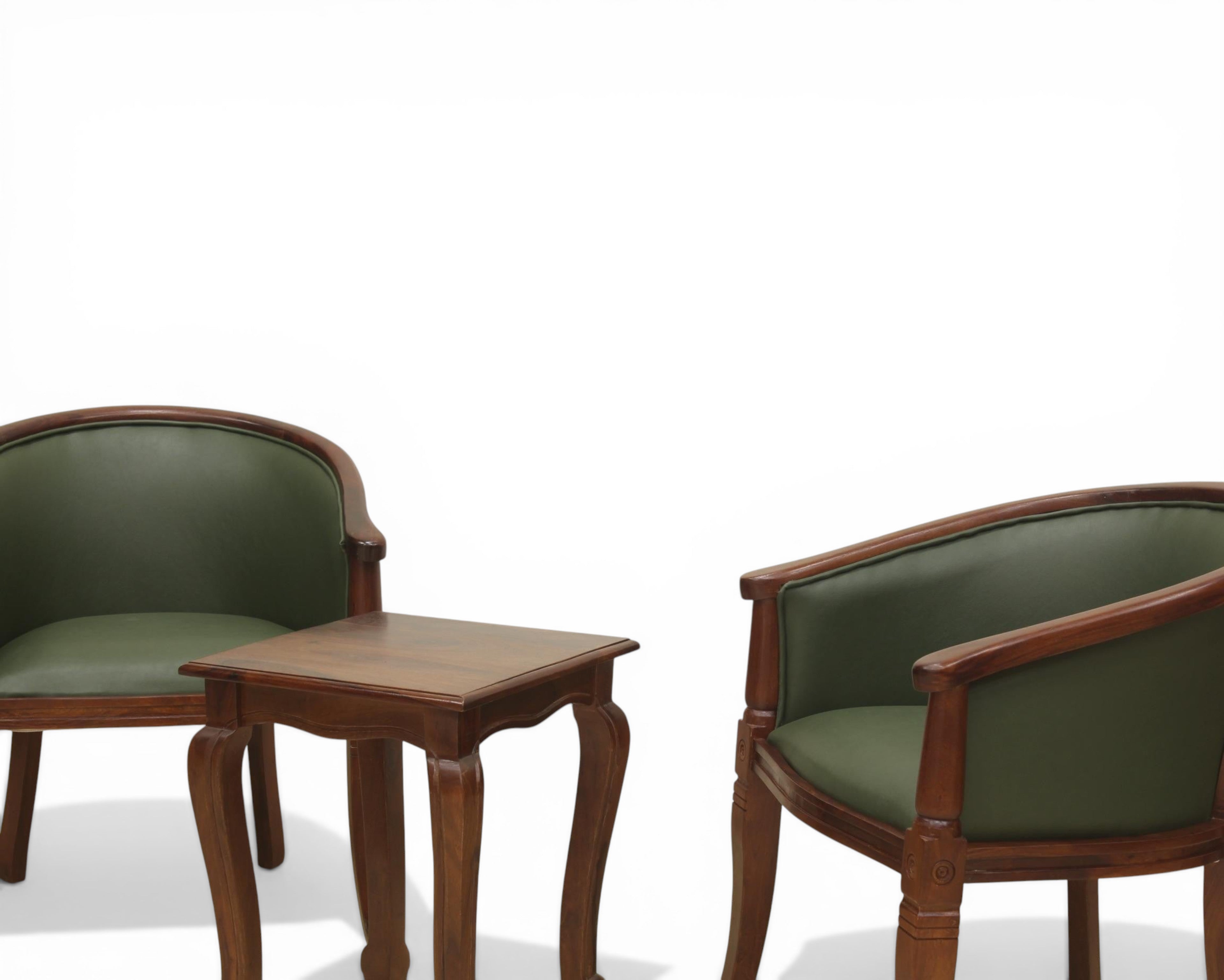 Nakoda Homes forest green faux leather barrel-back accent chair with dark wood frame and turned legs.