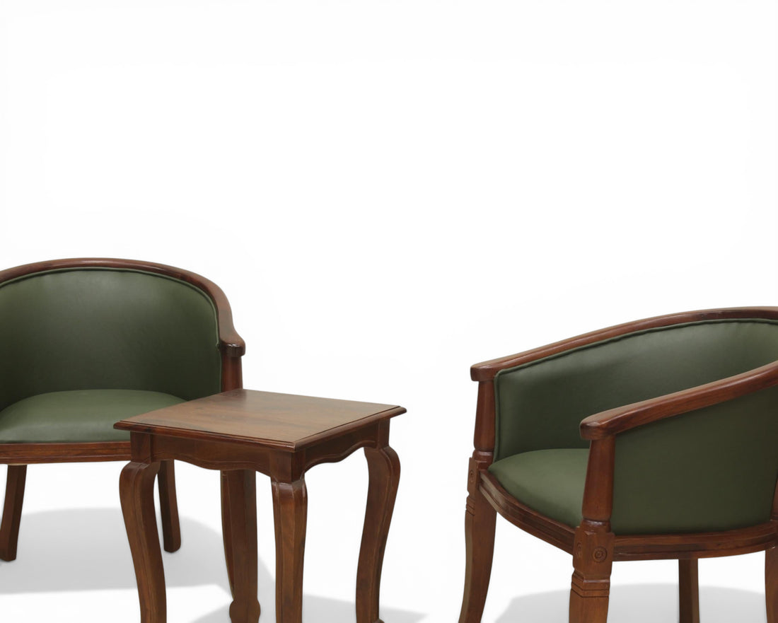 Nakoda Homes forest green faux leather barrel-back accent chair with dark wood frame and turned legs.