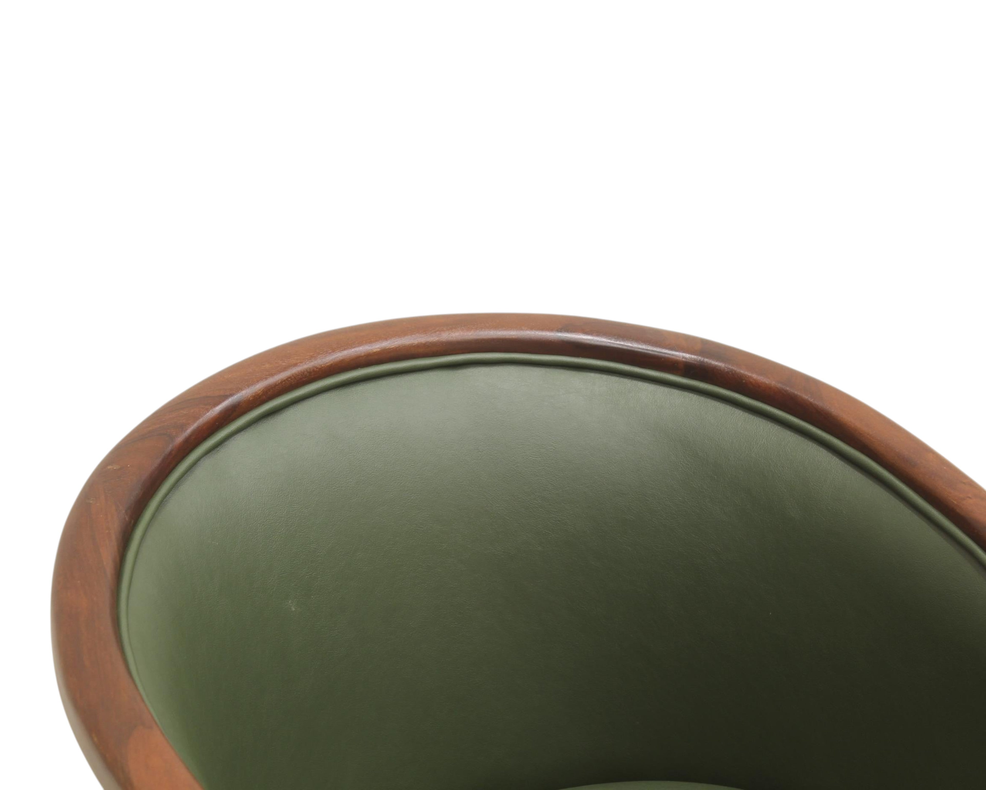 Nakoda Homes forest green faux leather barrel-back accent chair with dark wood trim and curved top.