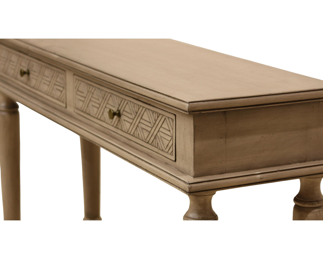 Nakoda Homes distressed grey wood console table with two carved drawers and brass knobs, turned legs.