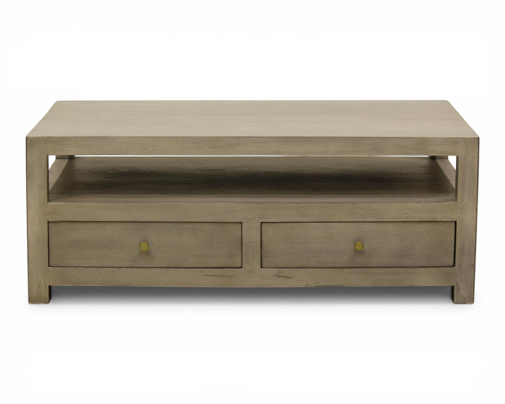 Nakoda Homes grey wash wood coffee table with open shelf and two brass knob drawers.