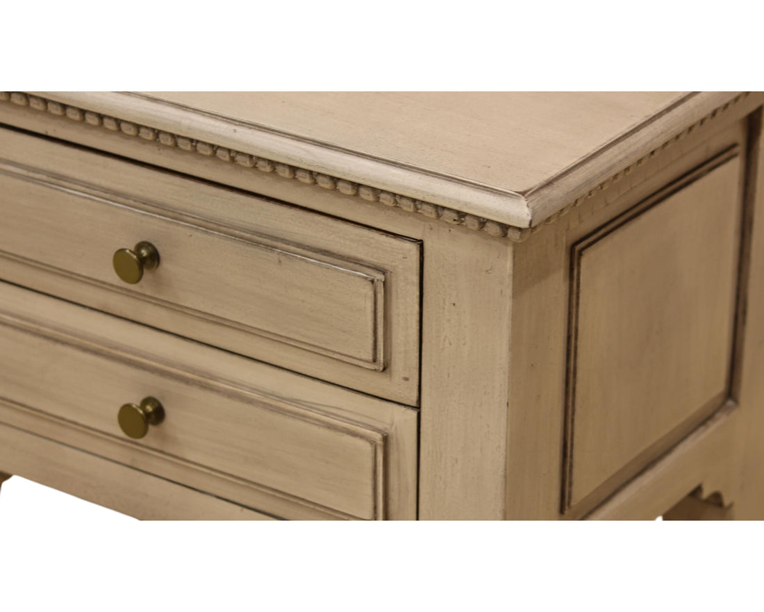 Nakoda Homes distressed grey wood two-drawer accent table with brass knobs and beaded trim