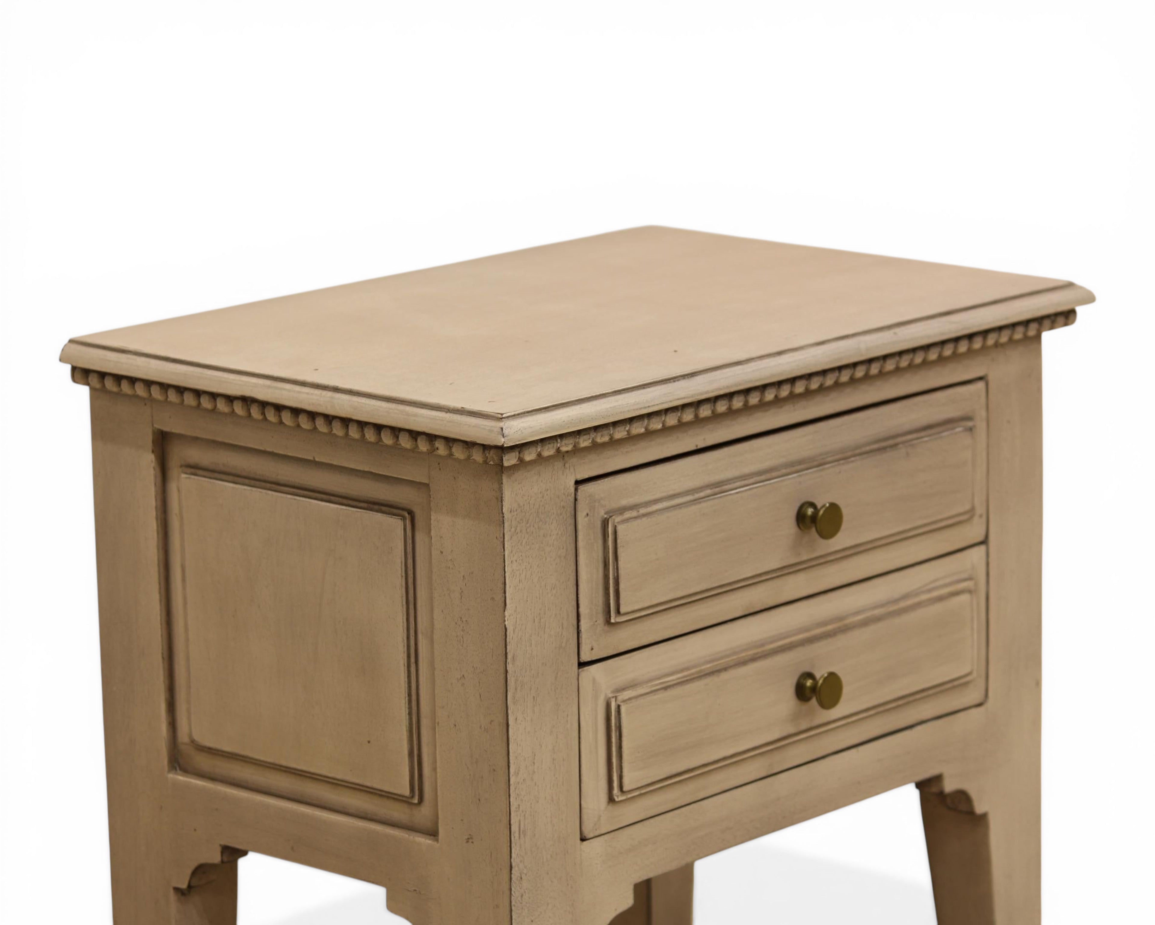 Nakoda Homes distressed grey wood two-drawer accent table with brass knobs and beaded trim.
