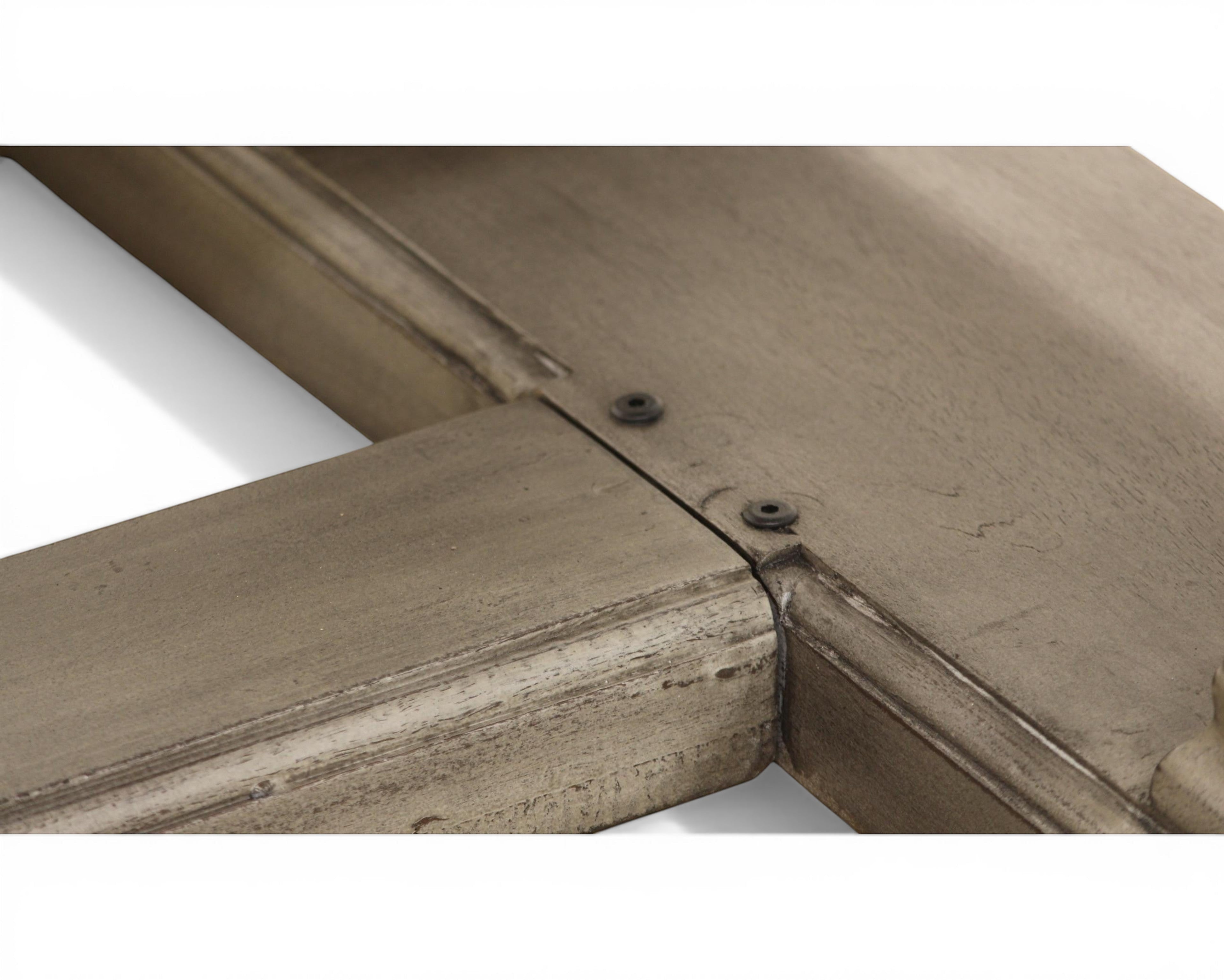 Nakoda Homes ornate grey wood console table with carved edge and pedestal base.