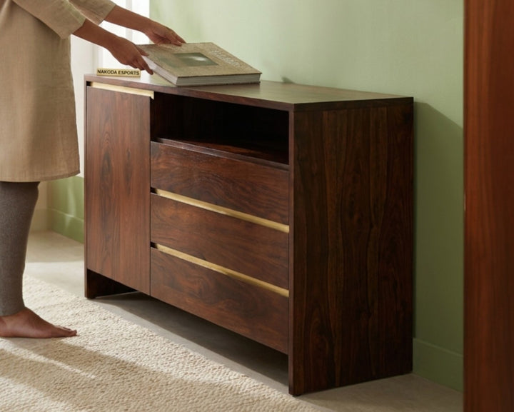 Nakoda Homes Maglory dark finish wood chest of drawers with brass handles and open shelf.