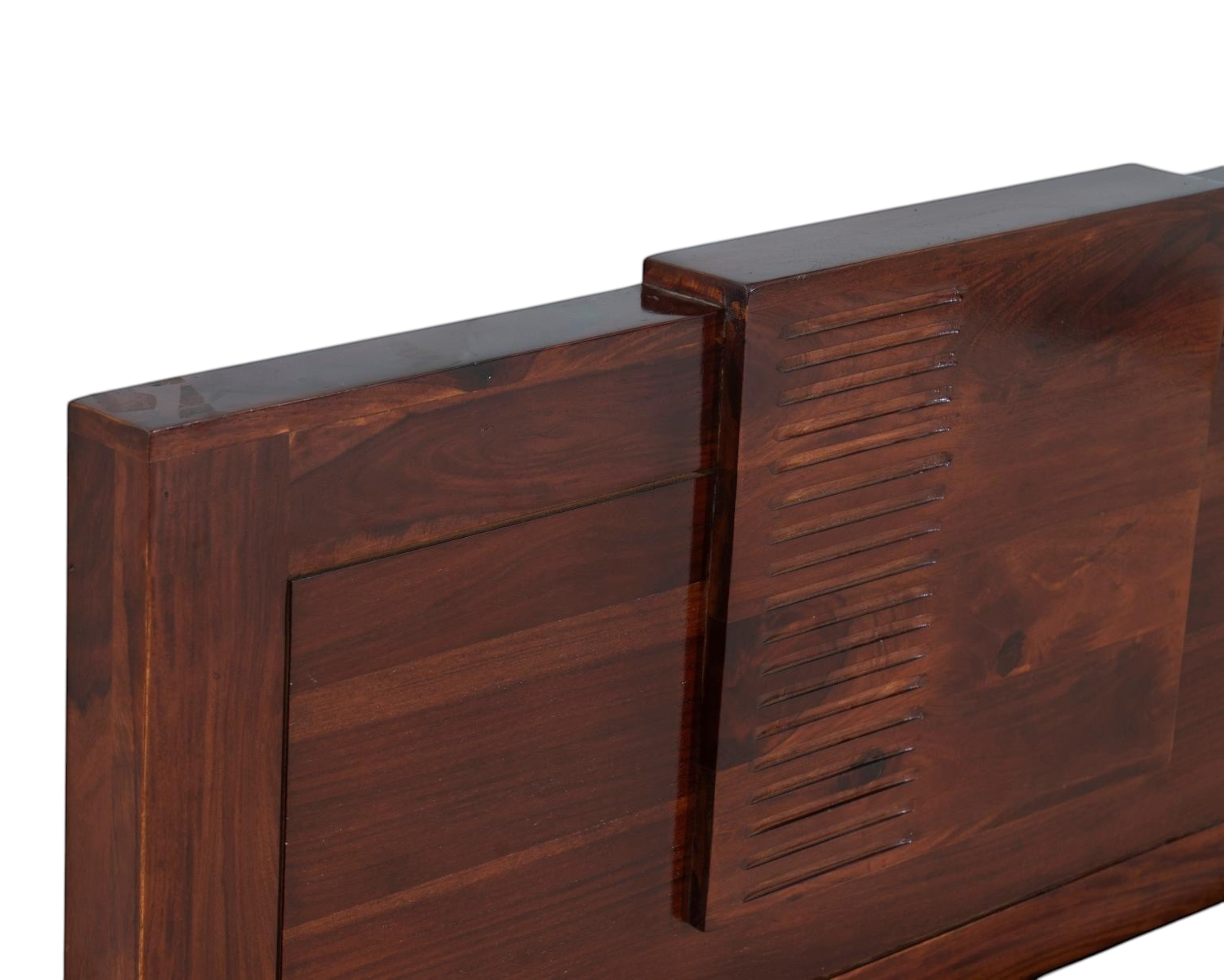 Nakoda Homes solid wood bed frame in warm brown with stepped, grooved headboard detail.