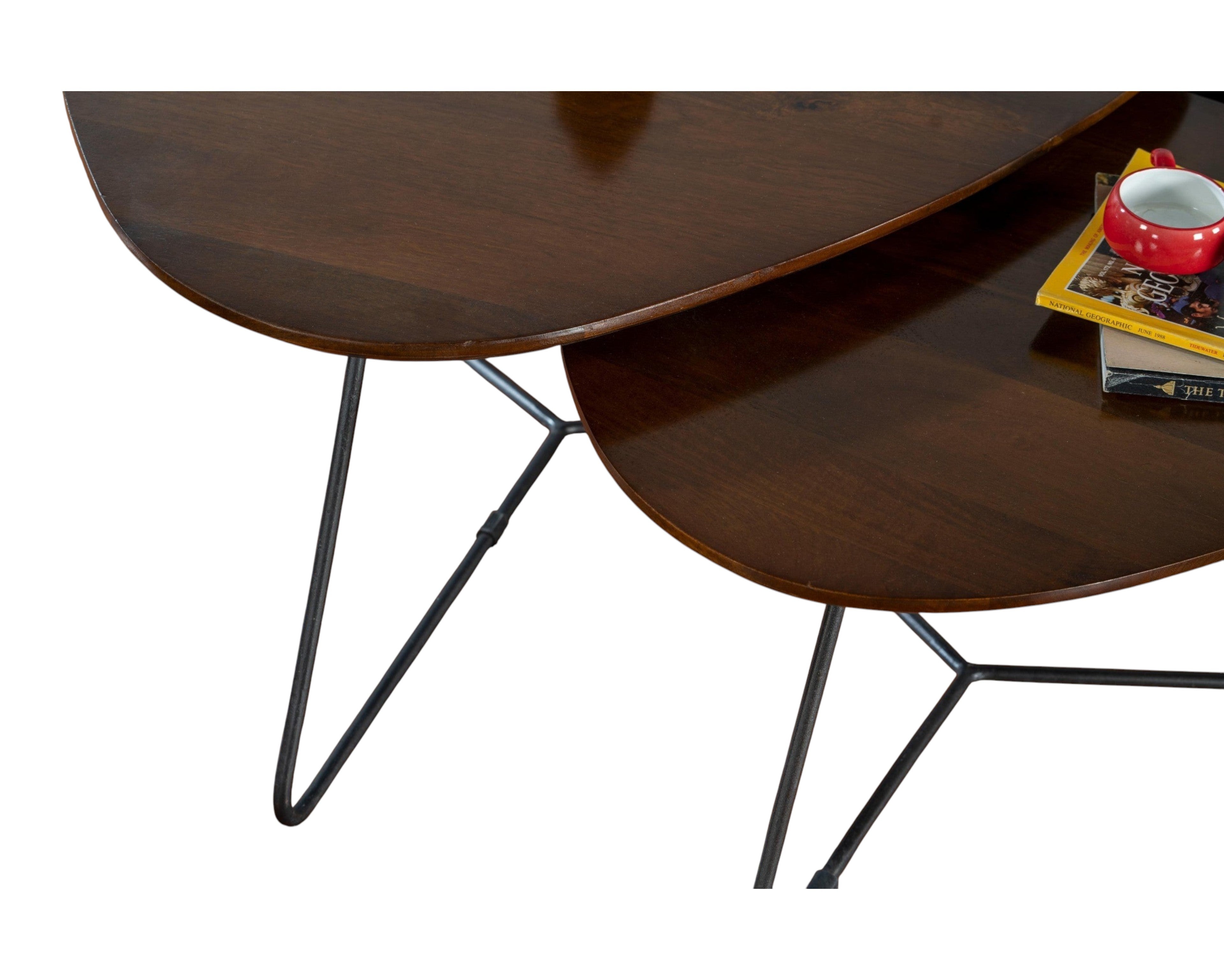 Nakoda Homes nesting coffee tables with dark wood tops and black metal legs.
