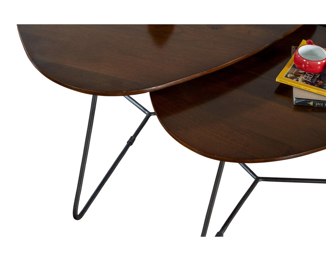 Nakoda Homes nesting coffee tables with dark wood tops and black metal legs.