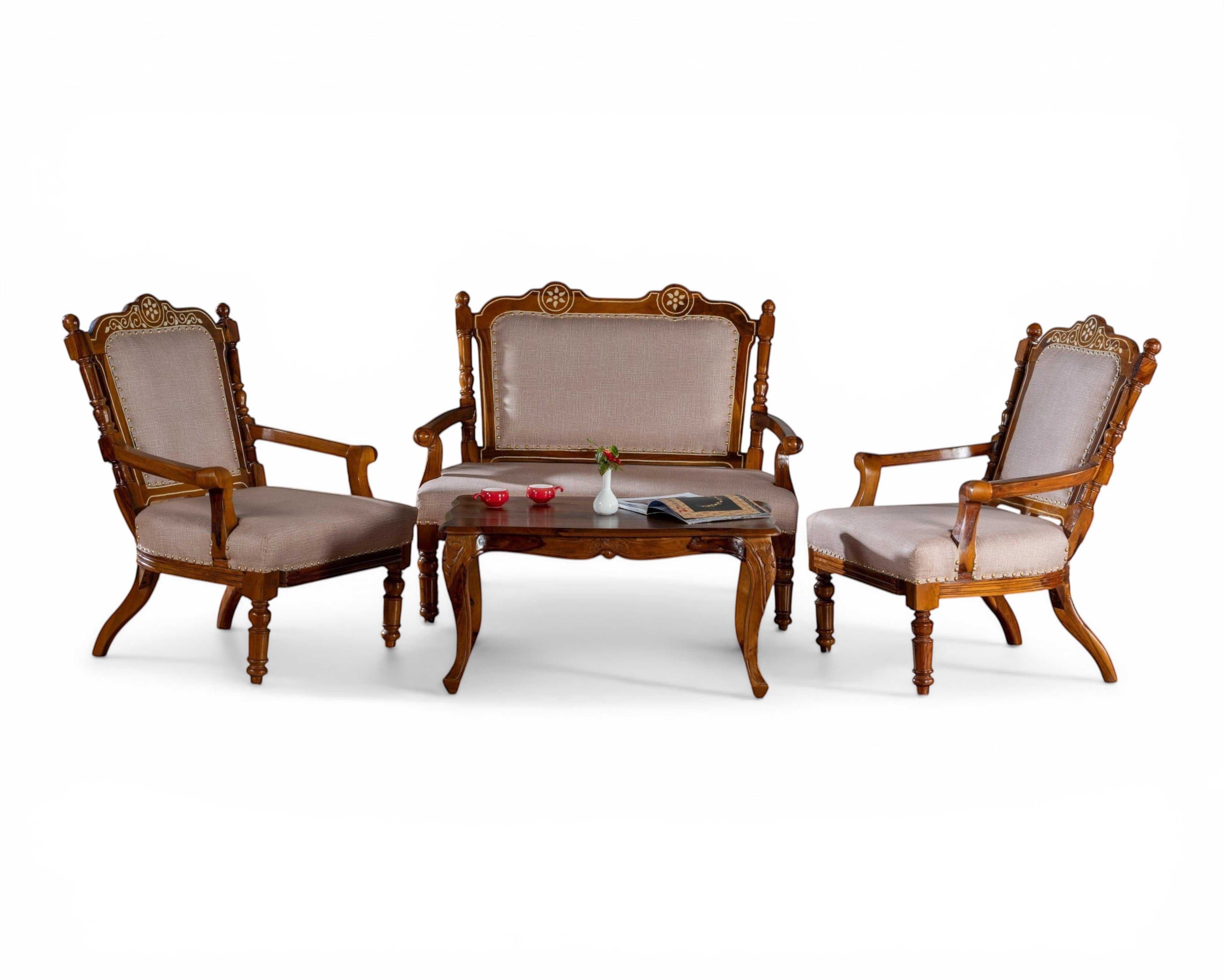 Nakoda Homes ornate carved wood armchair with neutral upholstered seat and back, nailhead trim, and curved legs.