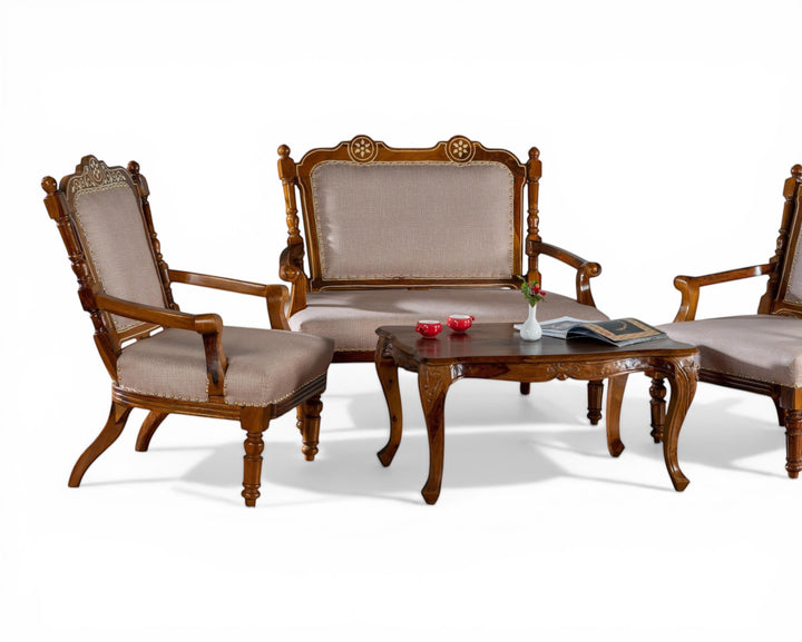Nakoda Homes ornate carved wood armchair with neutral upholstered seat and nailhead trim, classic design.