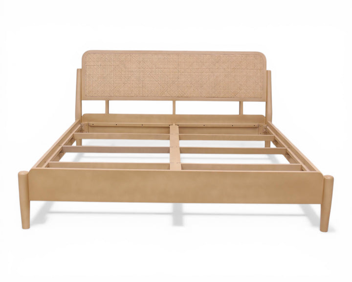 Nakoda Homes natural rattan headboard bed frame in light wood with minimalist design. Offers organic warmth and modern elegance.