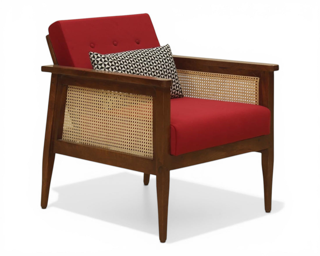 Nakoda Homes red armchair with wooden frame and cane detailing, includes accent pillows.