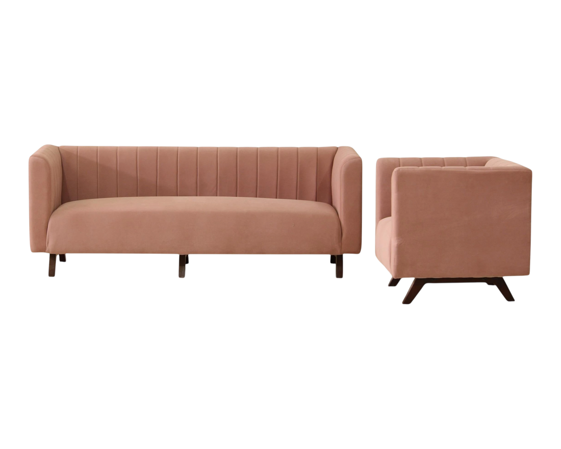 Nakoda Homes modern rose velvet sofa with channel tufting and dark wood legs. Includes accent pillows.