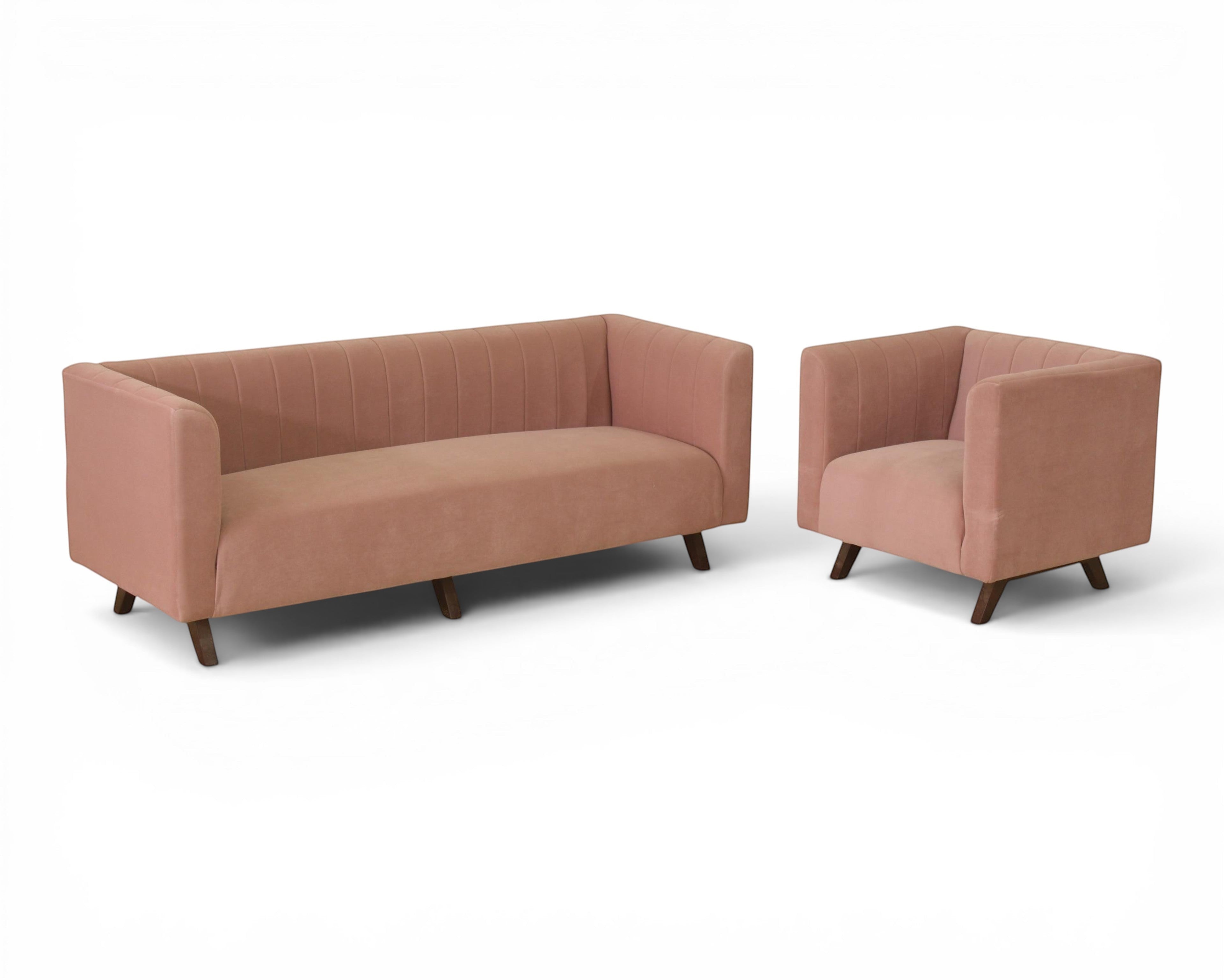 Nakoda Homes modern rose velvet sofa with channel tufting and dark wood legs. Includes accent pillows.