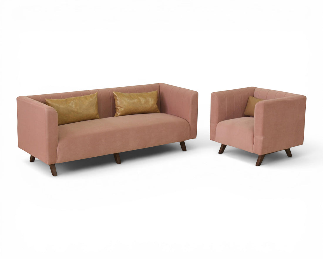 Nakoda Homes rose velvet sofa with channel tufting and faux leather accent pillows. Modern design for living rooms.