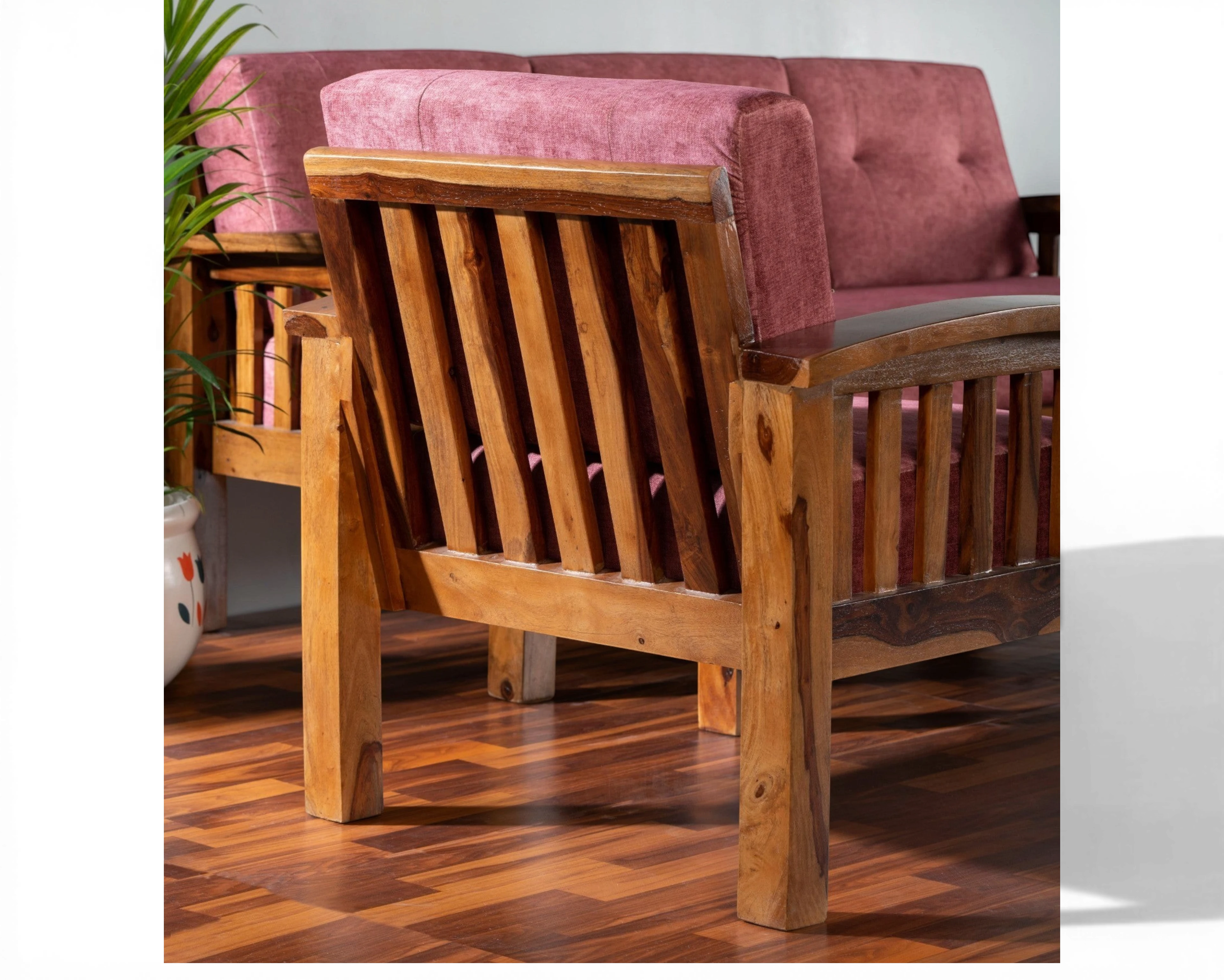 Nakoda Homes modern wooden sofa set with rose-colored upholstery and slatted back design.