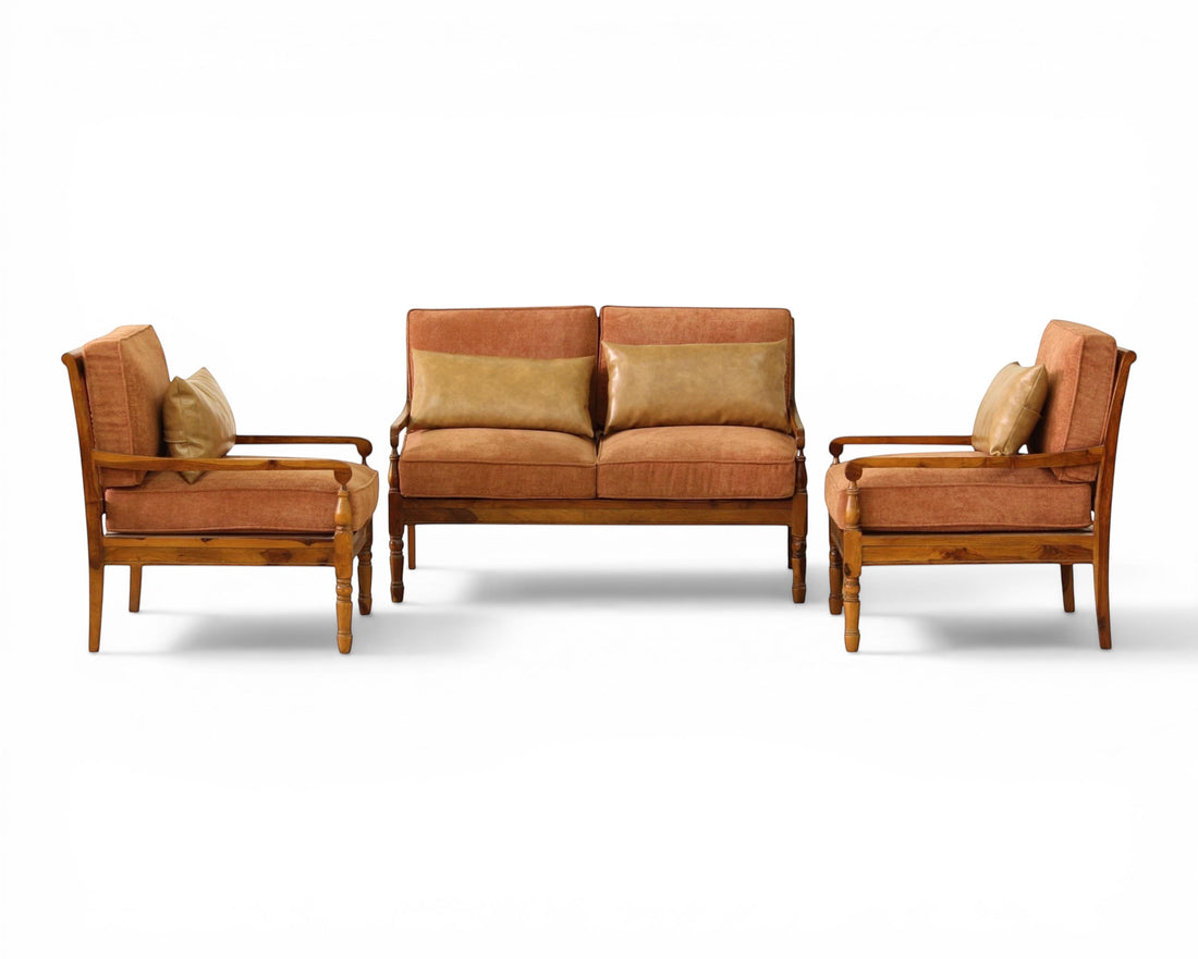 Nakoda Homes 3-piece living room sofa set in rust upholstery with wooden frame and tan lumbar pillows.