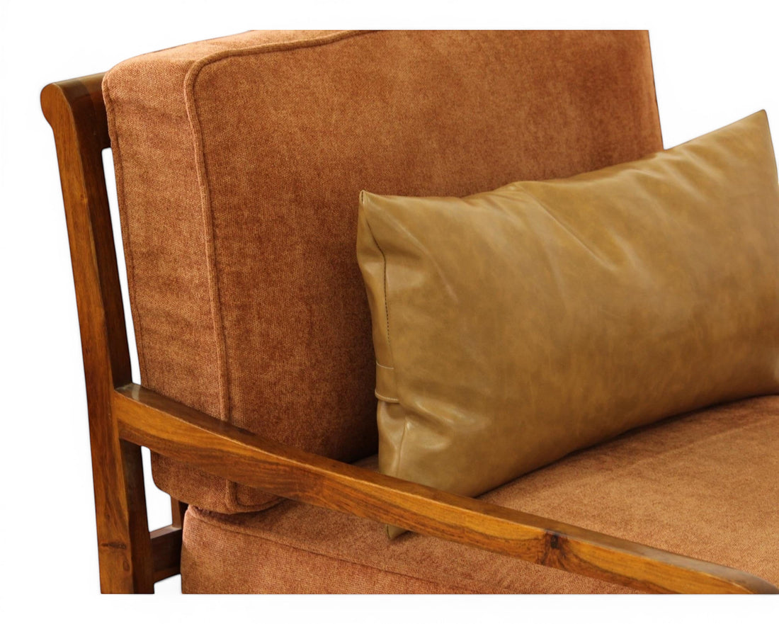 Nakoda Homes 3-piece sofa set in rust-colored fabric with wooden frame and tan faux-leather lumbar pillows.